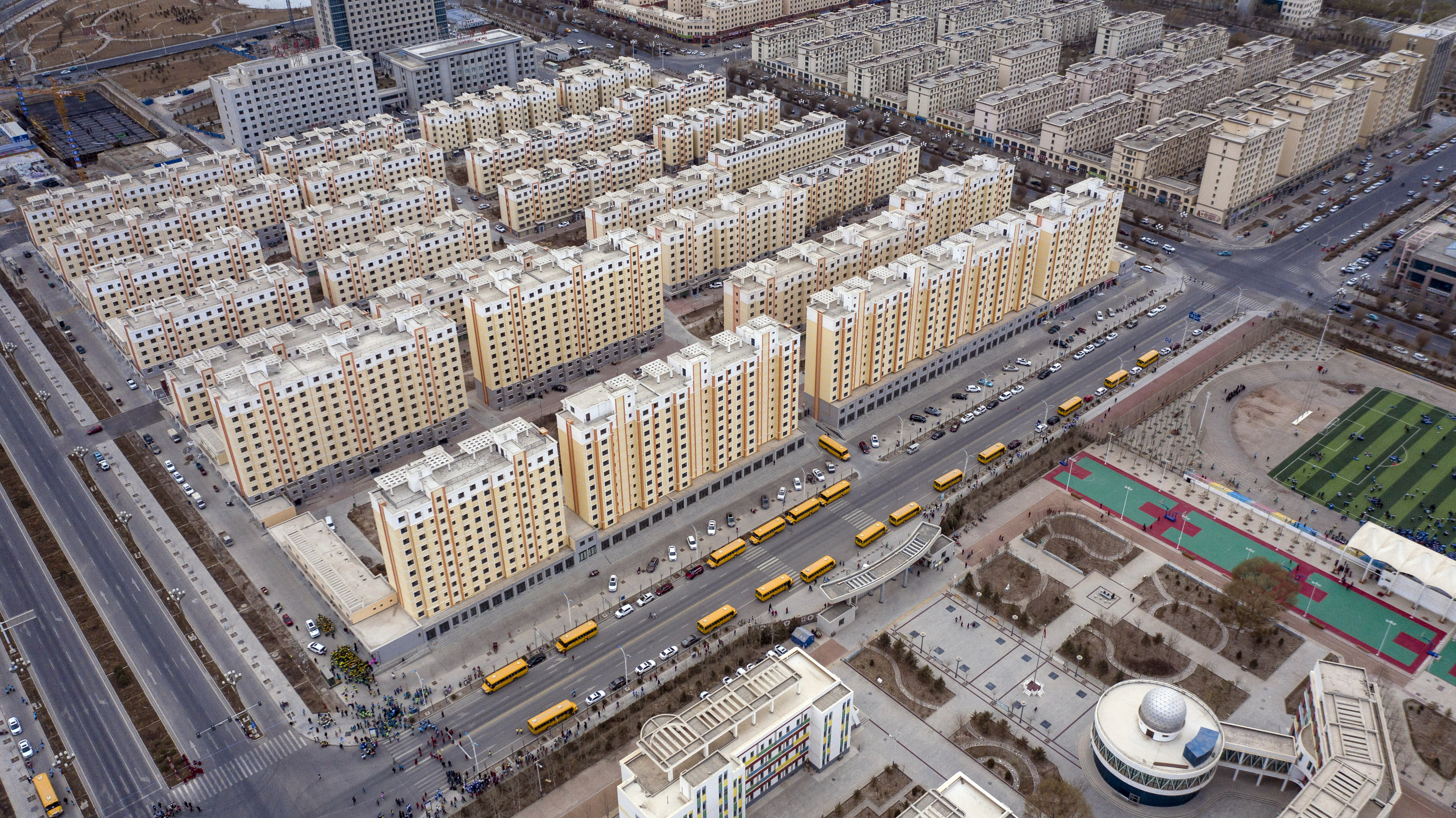 Residential buildings in Yumen, Gansu province, on March 31. While China is expected to approve plans for a nationwide property tax, its roll-out is expected to be graduate with several pilot programmes. Photo: Bloomberg