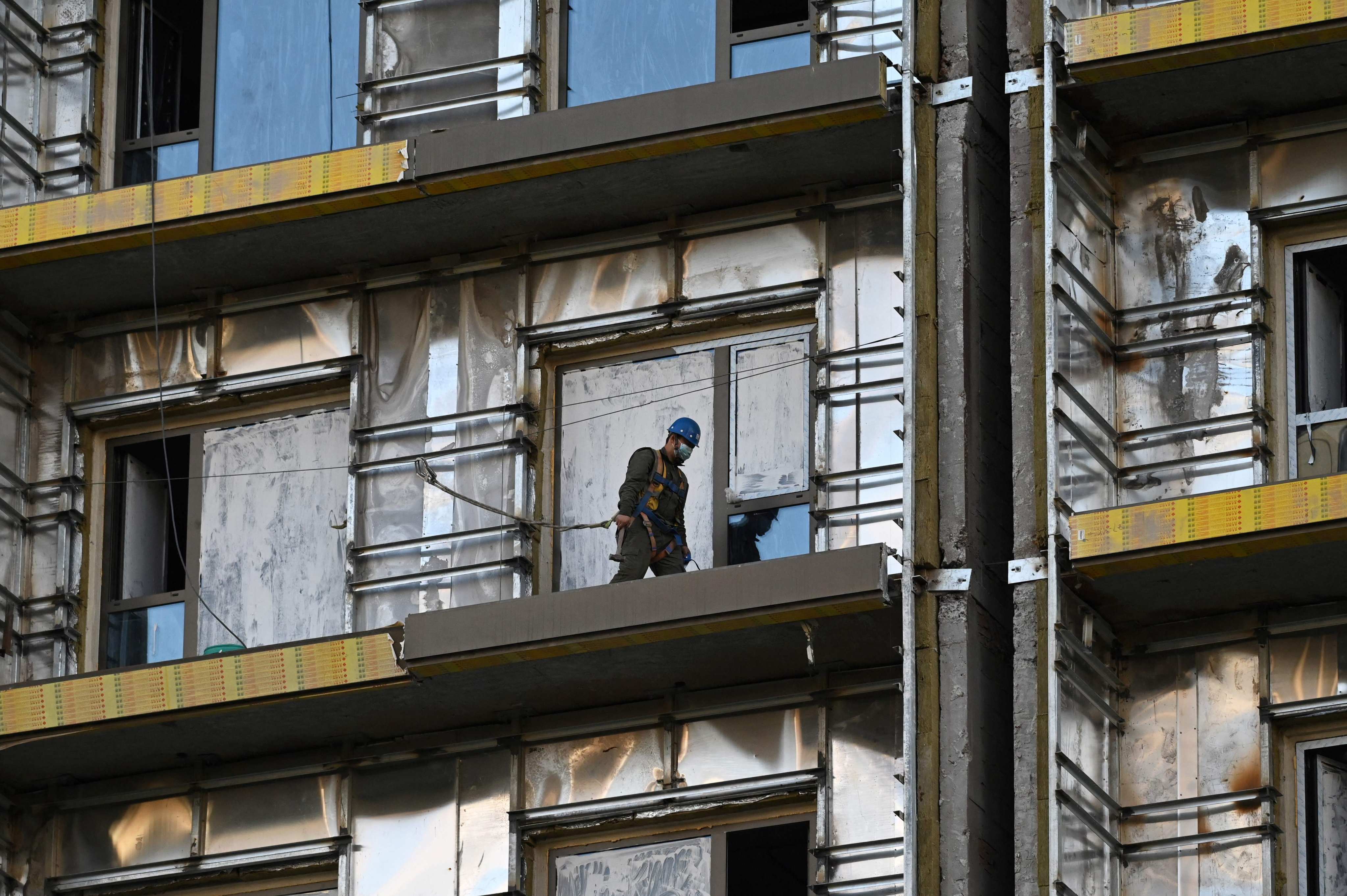 A man works at a construction site in Beijing on October 19. Photo: AFP