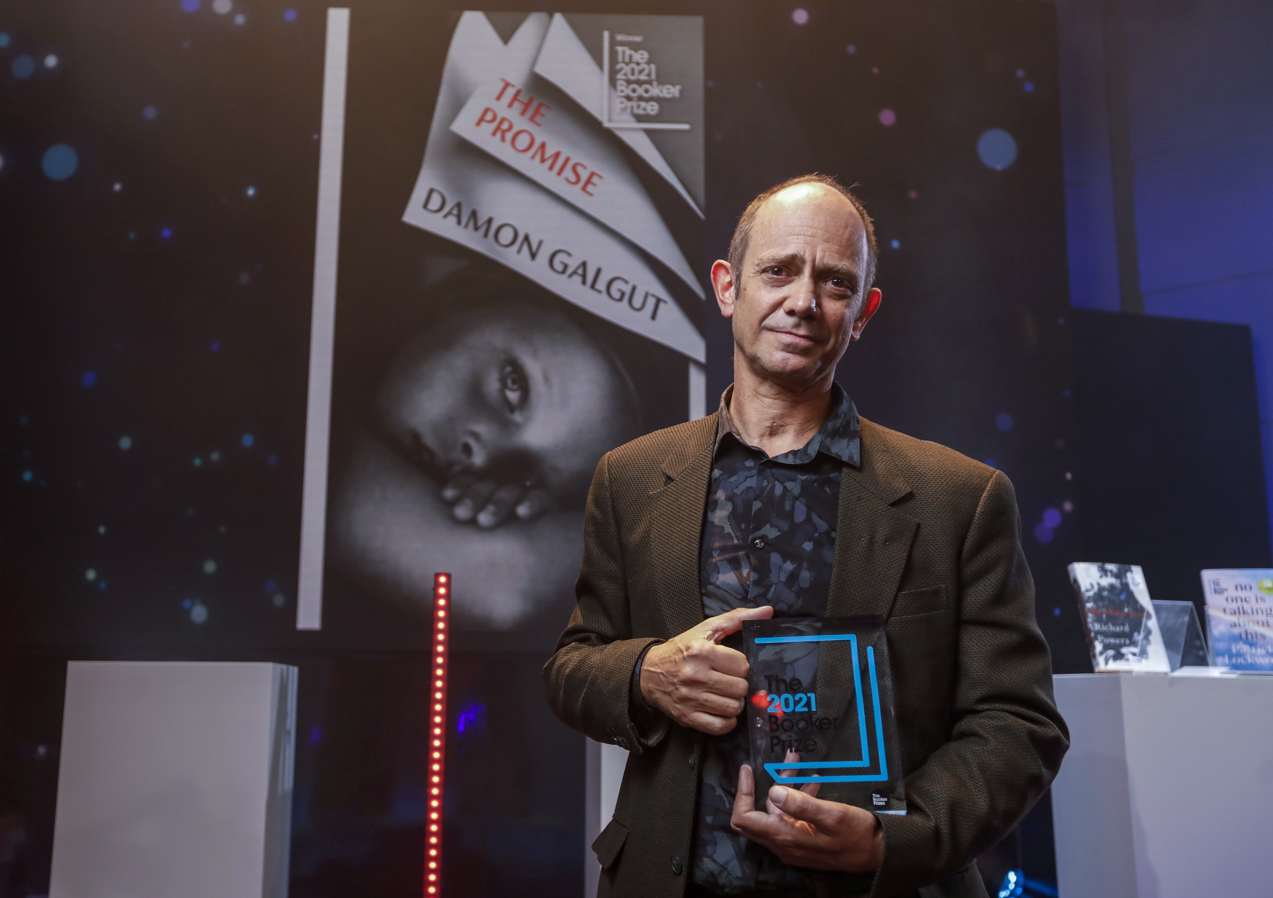 South African author Damon Galgut, winner of the 2021 Booker Prize for Fiction, at the awards ceremony at the BBC Radio Theatre in London on November 3. The annual prize, for the best original novel, written in the English language and published in the UK, was awarded for his book The Promise. Phoyoz; EPA-EFE/David Parry/PA Wire /The Booker Prize Press Office.