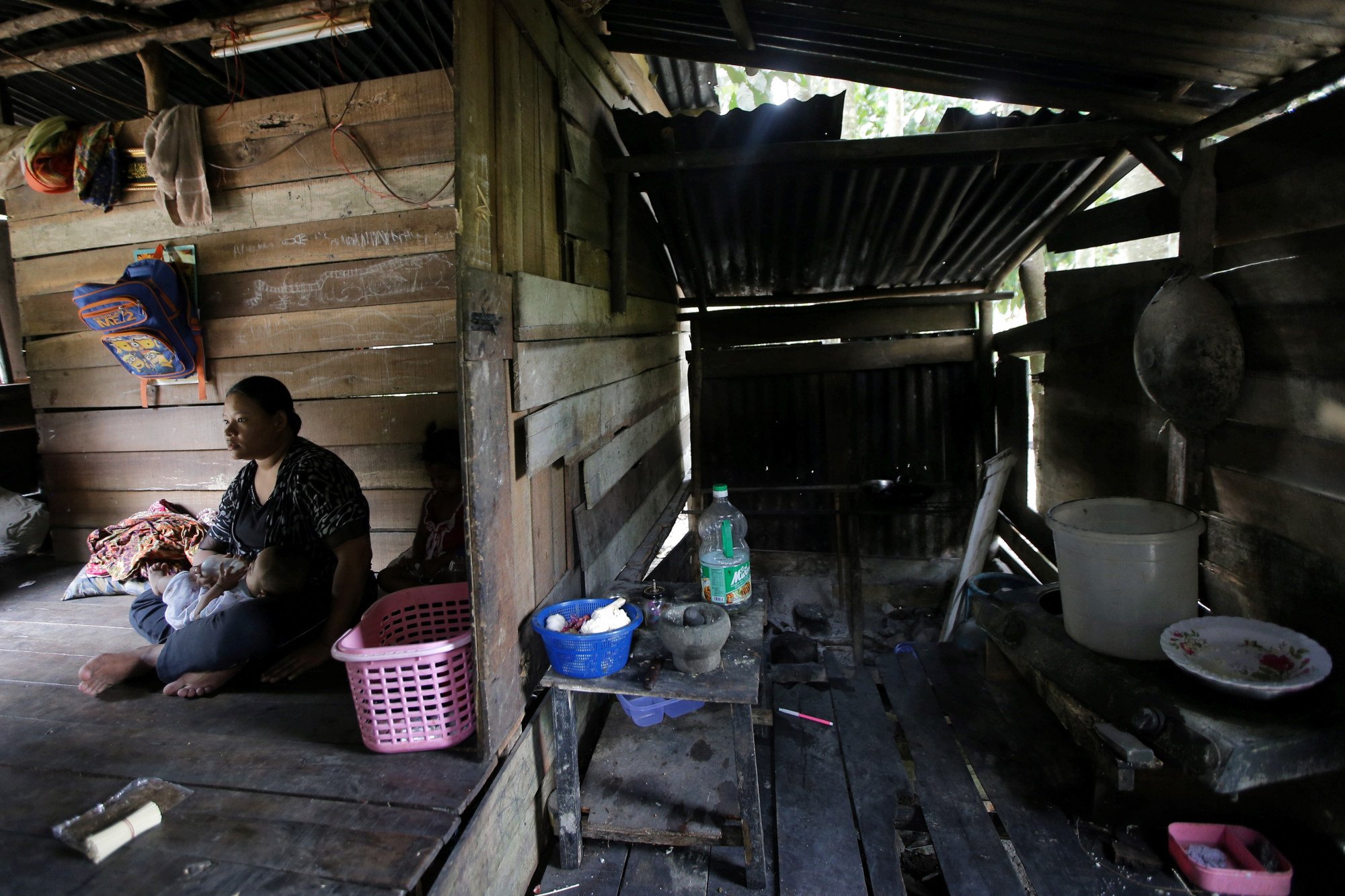 A family at a home without water and power in Selangor. Malaysia’s NEP is designed to improve the lives of disadvantaged Malays and native groups. Photo: Shutterstock