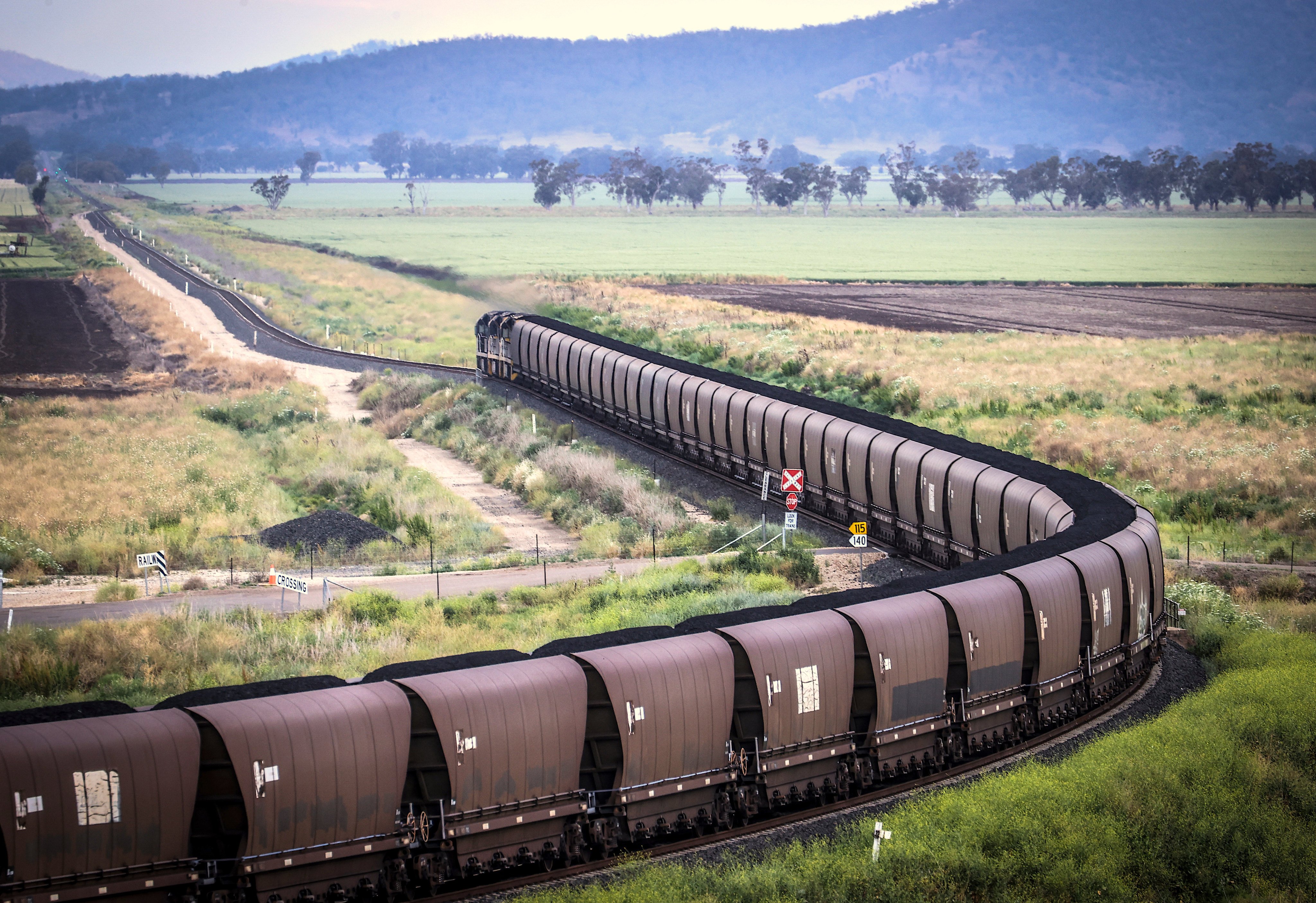 A freight train transports coal through the New South Wales countryside on October 13, 2020. Australian Prime Minister Scott Morrison and his government have come under heavy criticism for refusing to join global efforts to phase out coal and methane emissions over domestic political concerns. Photo: Bloomberg