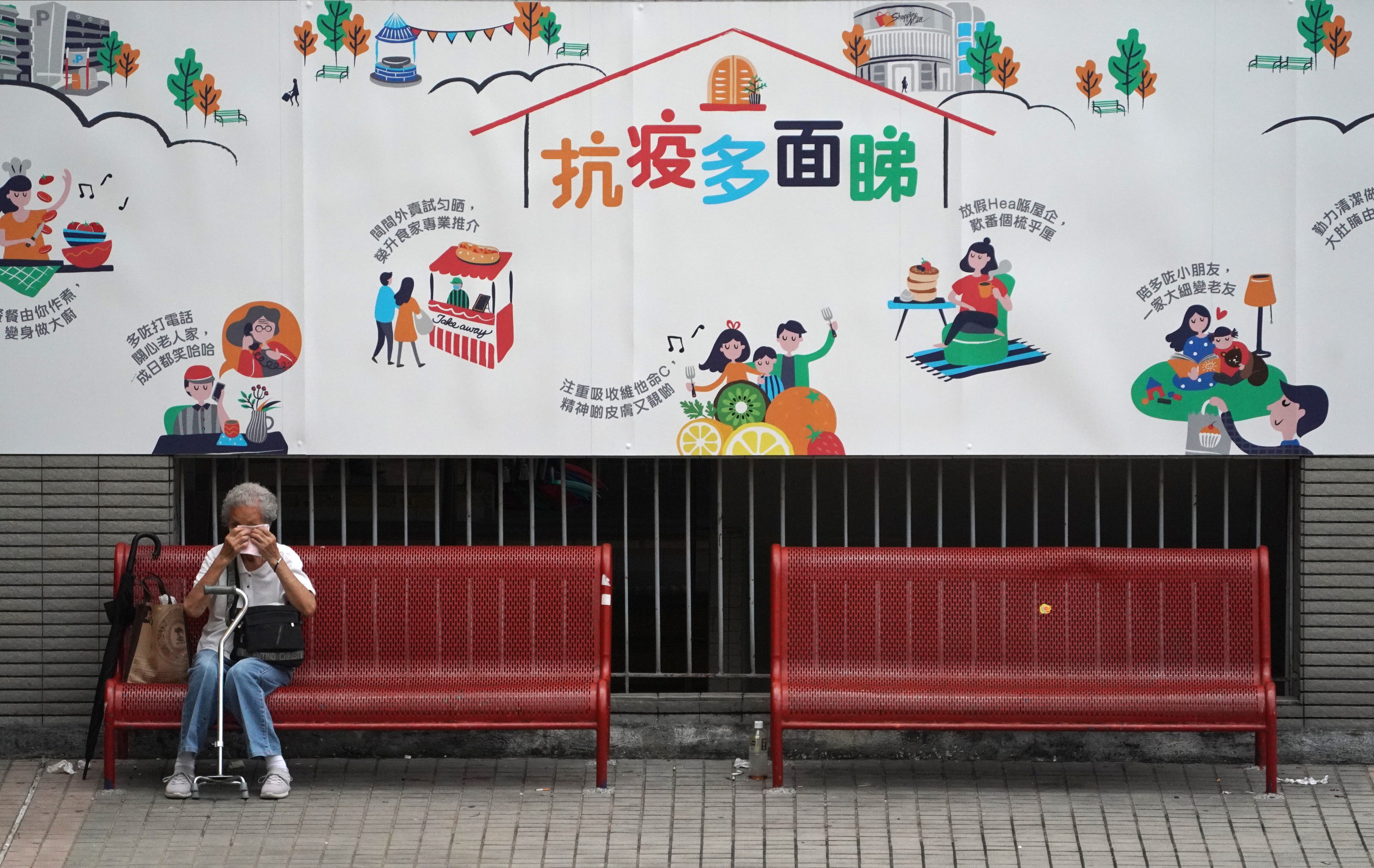 An elderly woman sits alone on a bench in Sha Tin on August 28, 2020. Living alone, being a woman and being widowed have all been identified as risk factors for at-home suicide. Photo: Felix Wong