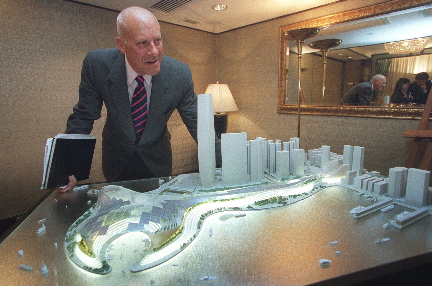 British architect Norman Foster stands next to a model of his winning proposal for the West Kowloon cultural and entertainment complex in 2002. His plan was scrapped in 2006 on cost grounds, but his firm won the tender to implement a revised blueprint in 2011. Photo: SCMP