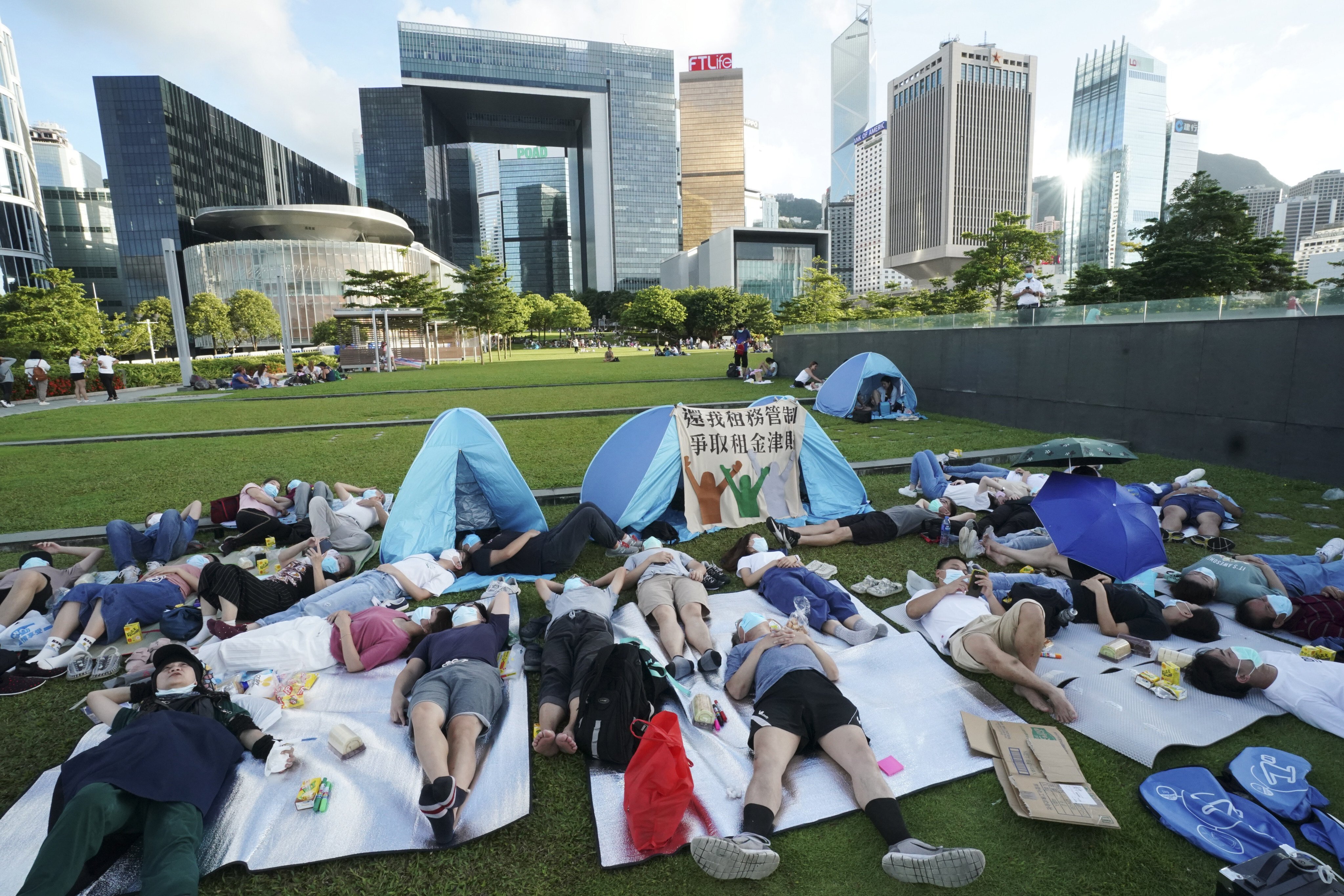 Young people take part in a “sleep with you” protest at Tamar Park, Admiralty, urging government action to tackle housing, poverty and homelessness in Hong Kong, on July 5, 2020. Photo: Felix Wong