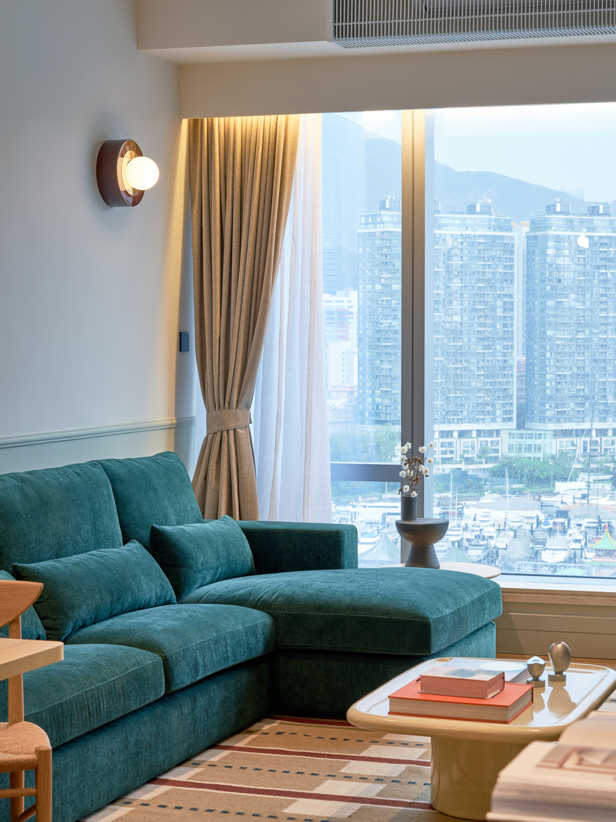 A sofa upholstered in Hong Kong tram green, or Generation Z green as designer JJ Acuna calls it, is a feature of an Ap Lei Chau flat full of nostalgic touches. Photo: Xu Liang Leon