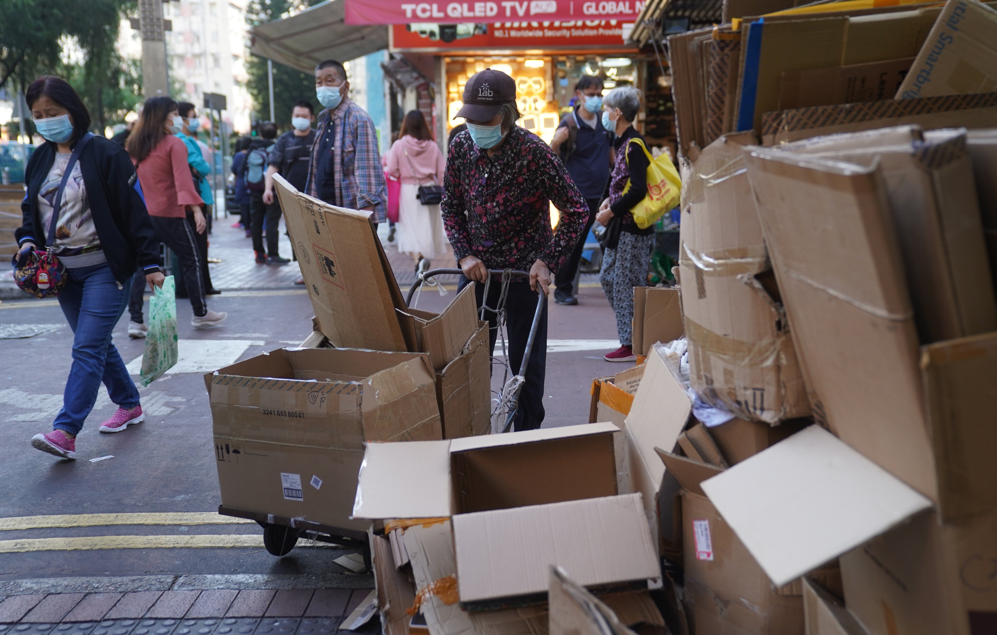 An elderly woman collects cardboard in Sham Shui Po on November 15.  Photo: Sam Tsang