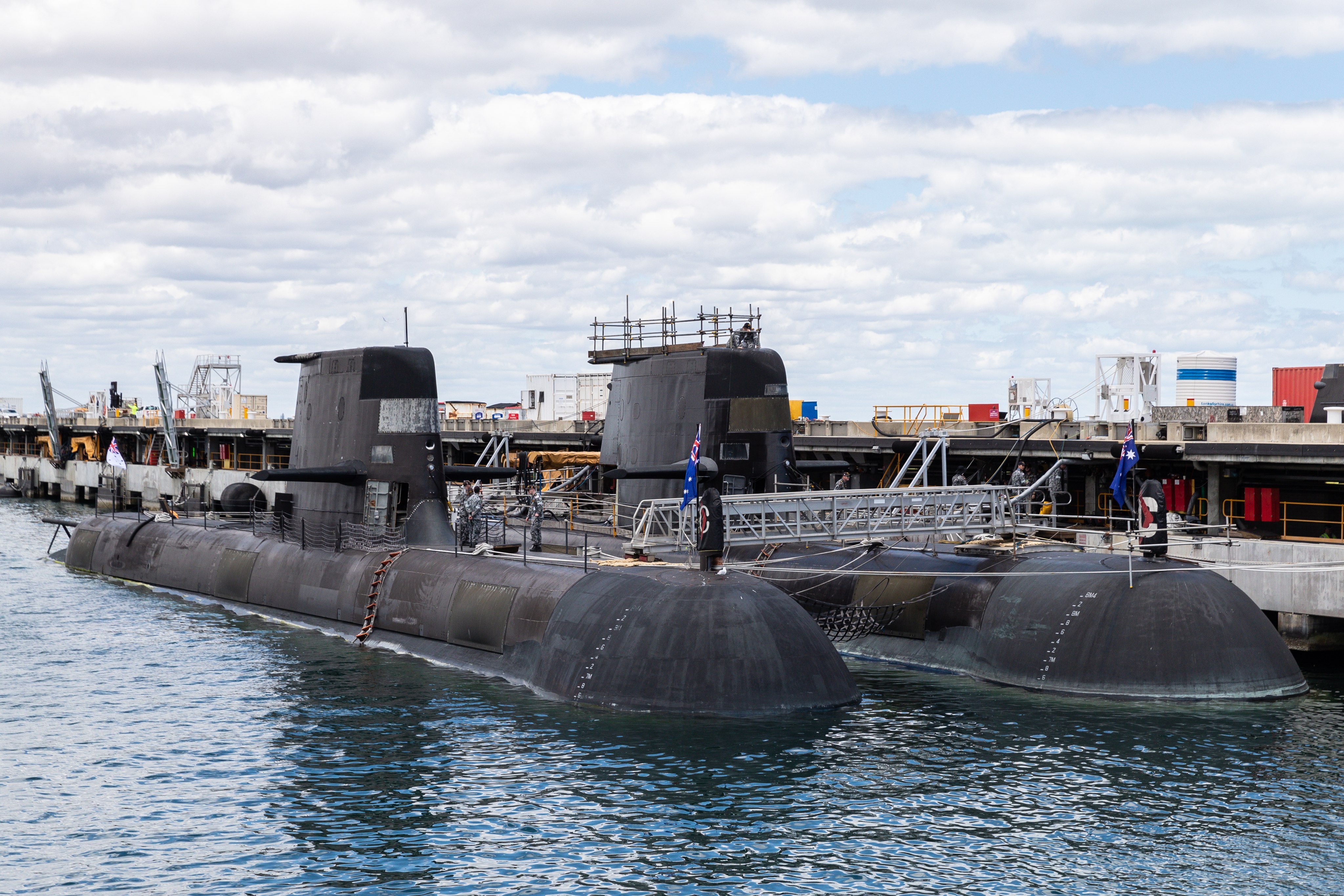 Two Australian Collins class submarines are docked at HMAS Stirling Royal Australian Navy base in Perth, Western Australia, on October 29. Australia is committed to getting its first nuclear-powered submarines built and operating as quickly as possible, Defence Minister Peter Dutton has said. Photo: EPA-EFE