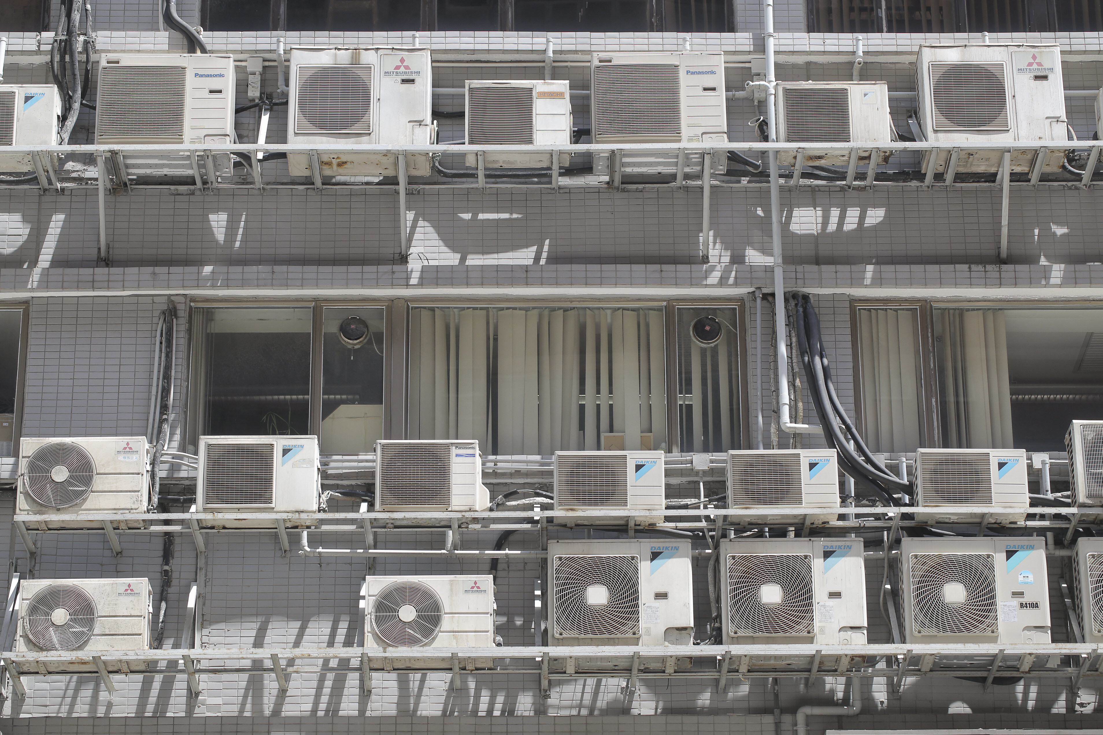Rows of air-conditioners outside an industrial building at Lai Chi Kok on August 5, 2016. Photo: Paul Yeung