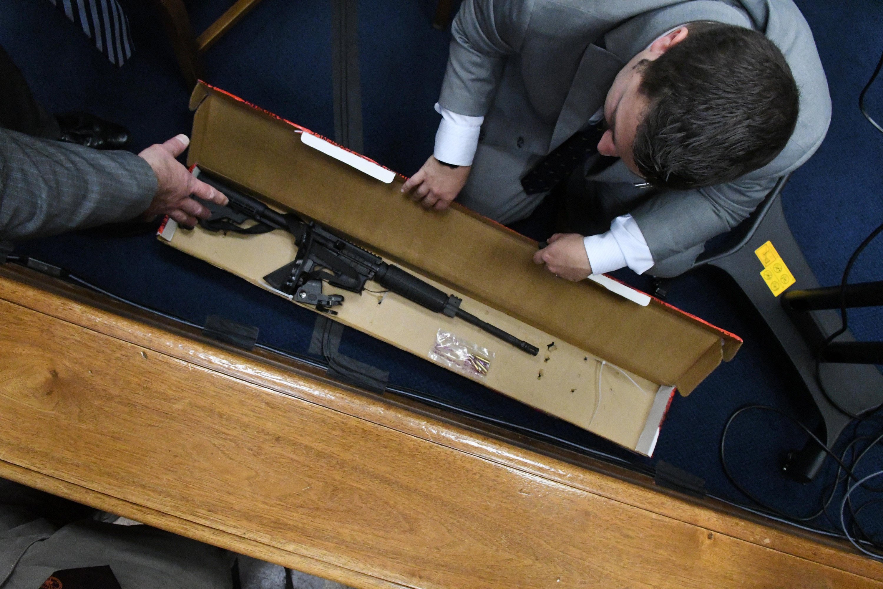 Defence attorney Mark Richards asks Kenosha Police detective Ben Antaramian to show him Kyle Rittenhouse’s rifle and bullets before court started on November 9. Photo: TNS