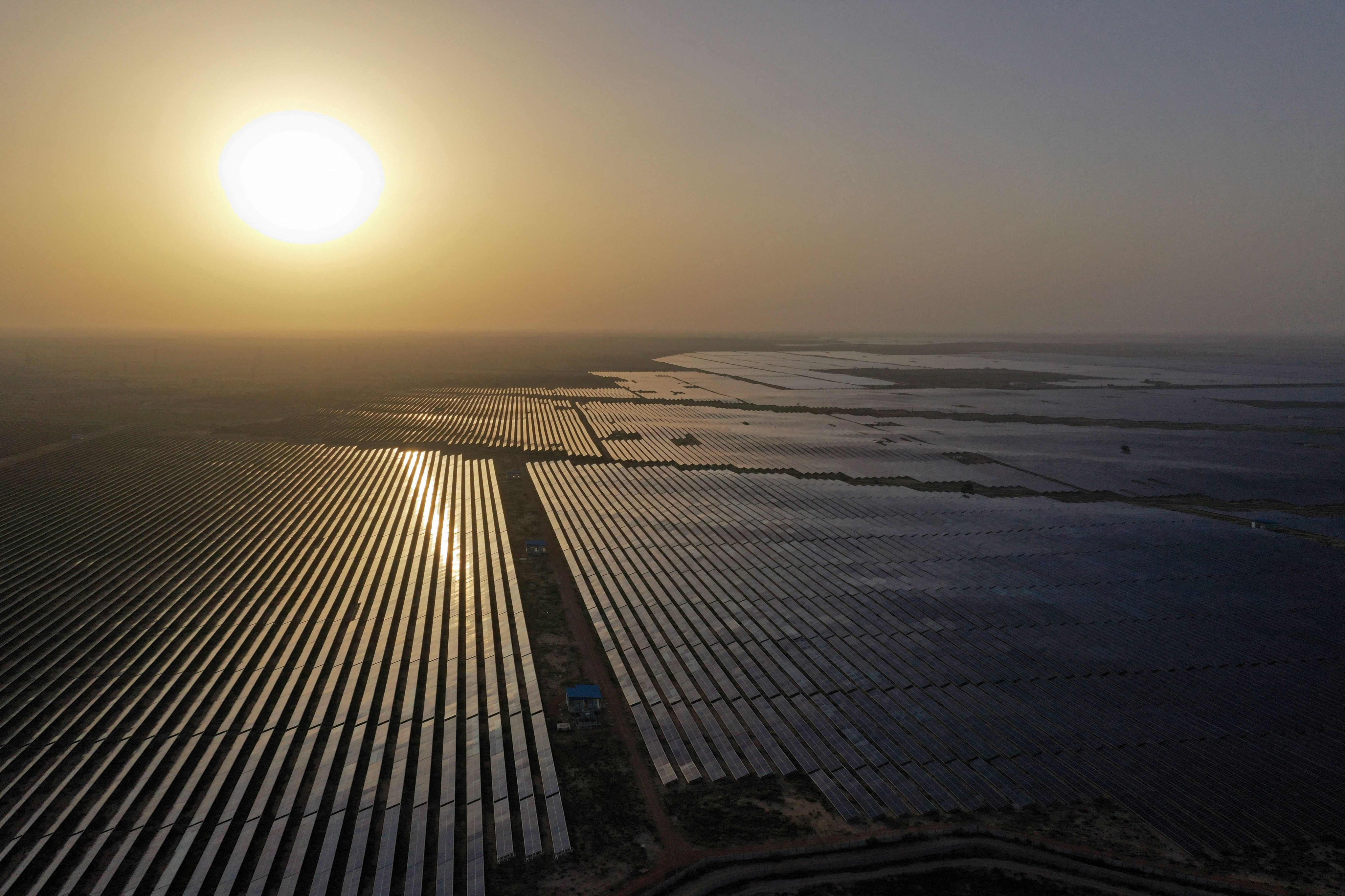 Solar panels span the site of energy projects developer Saurya Urja at the Bhadla Solar Park in Bhadla, in the northern Indian state of Rajasthan, on October 6. Coal powers 70 per cent of India’s electricity generation, but it has ambitious plans to produce 450 gigawatts through solar and other renewables by 2030. Photo: AFP