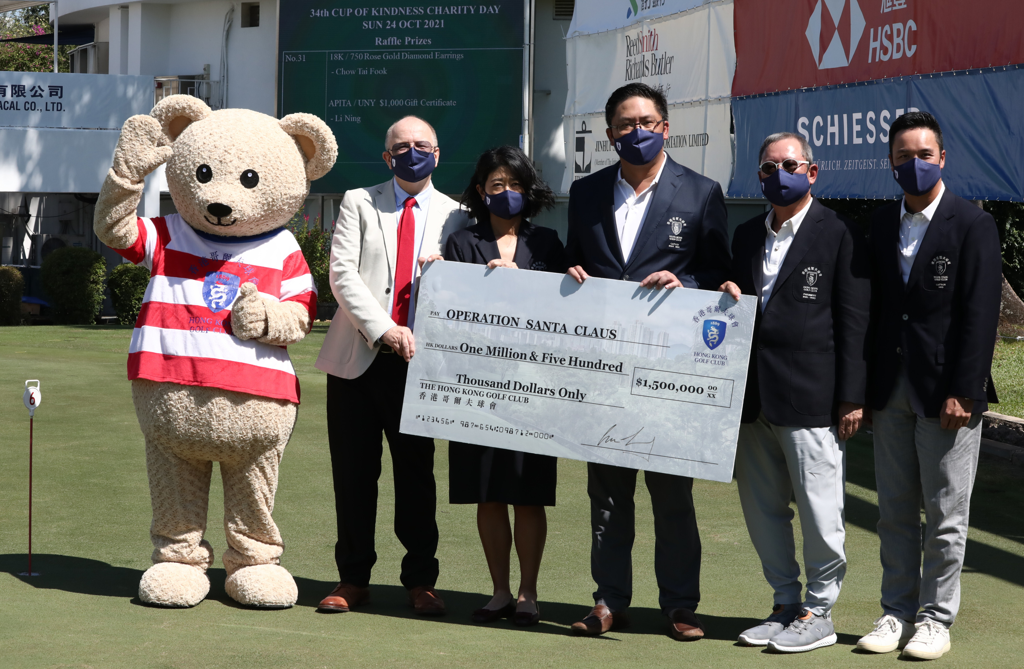 (From left) Hong Kong Golf Club mascot Fanling Freddie, RTHK’s Hugh Chiverton, lady captain Jane Lo, captain Clarence Leung, Trade Development Council chief Peter Lam and charity committee chairman William Doo Jnr at the golf club in October. Photo: Jonathan Wong