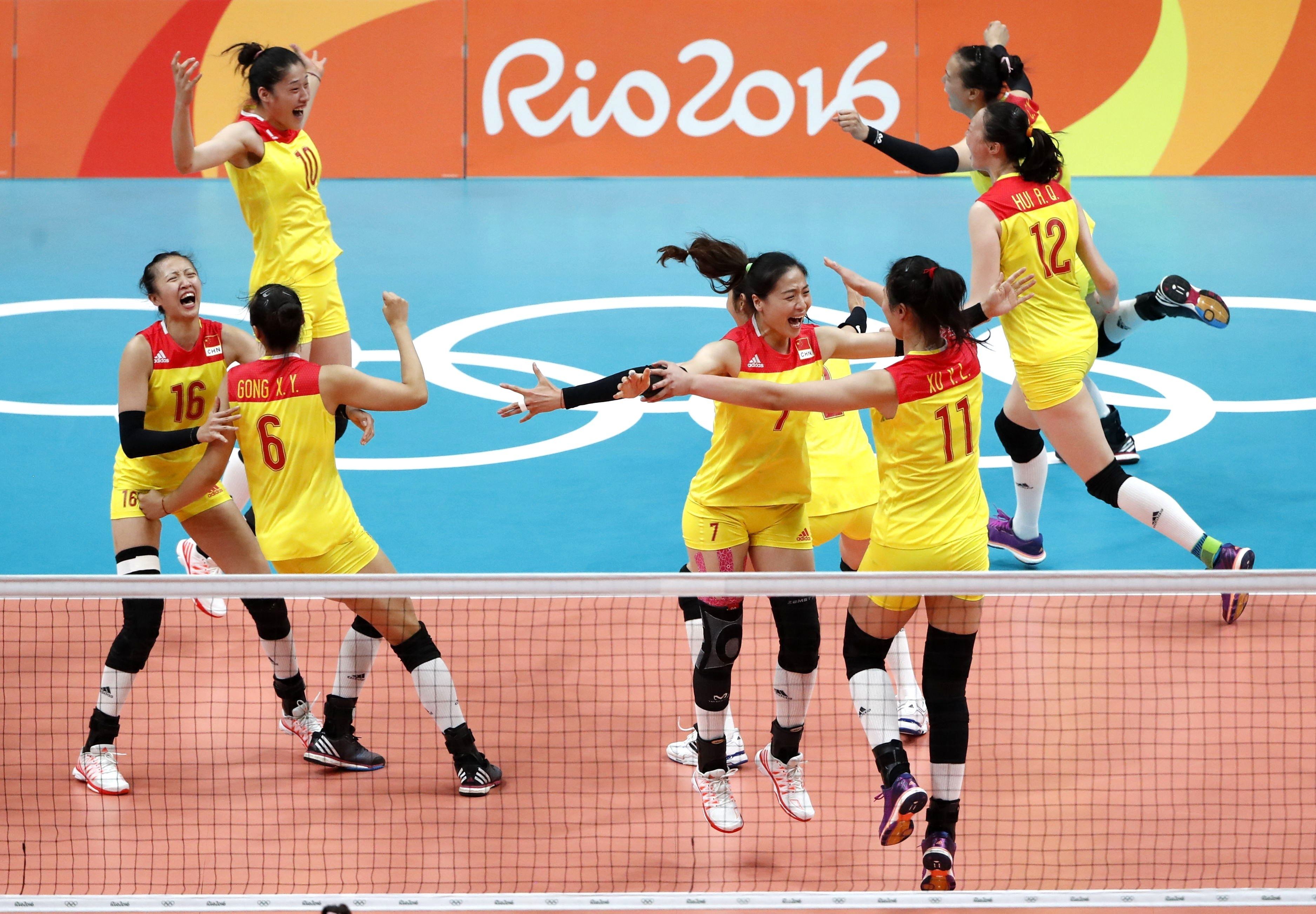 China women’s volleyball team player Liu Xiaotong (top left) celebrates with her teammates after their gold medal final win against Serbia at the 2016 Rio Olympic Games in Brazil. Photo: Xinhua   