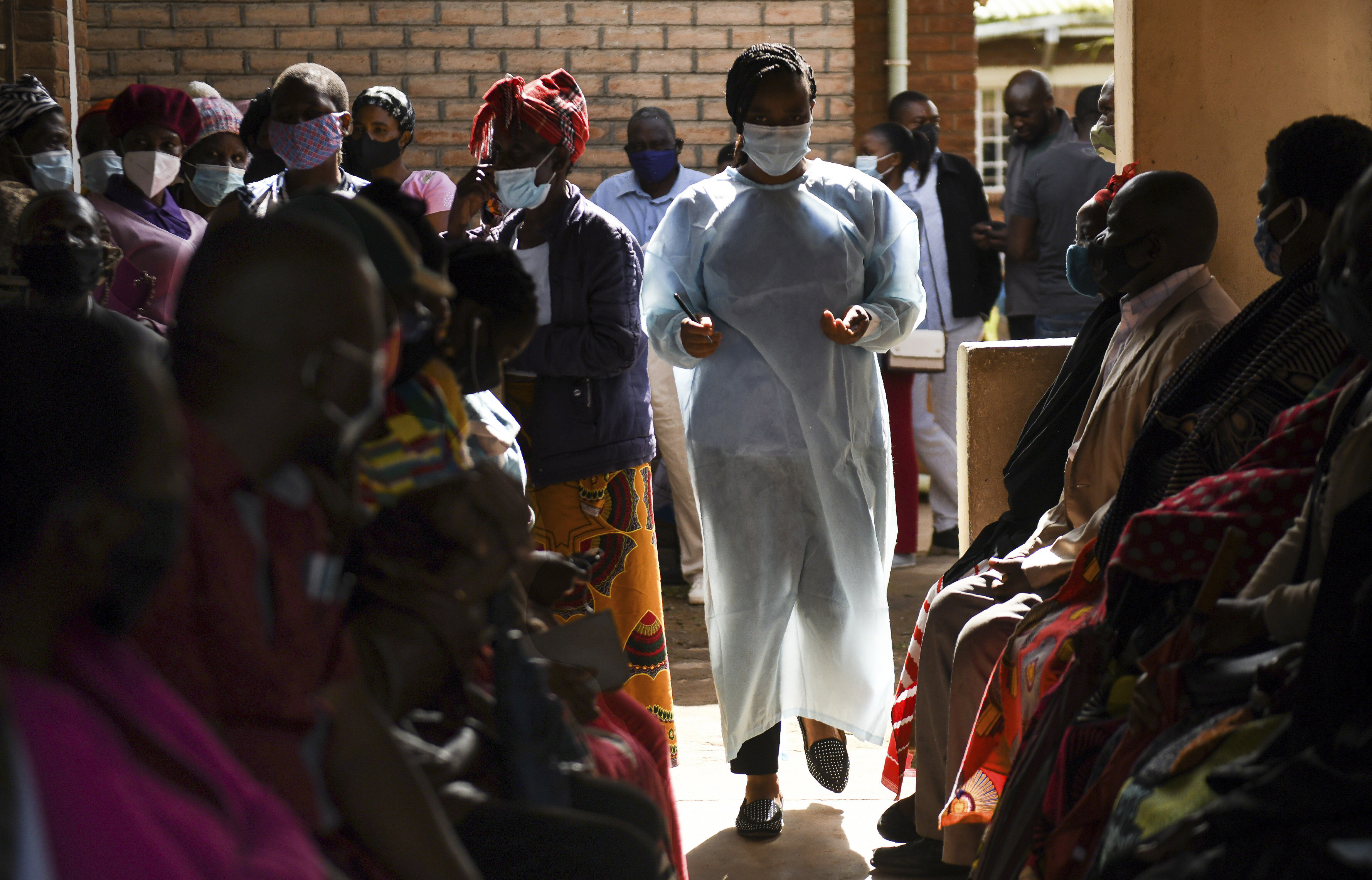 Numbers are handed out to people waiting to receive the AstraZeneca Covid -19 vaccine at a health centre in Blantyre, Malawi, on March 29. More than 90 per cent of Africa’s population has yet to be fully vaccinated against Covid-19. Photo: AP 