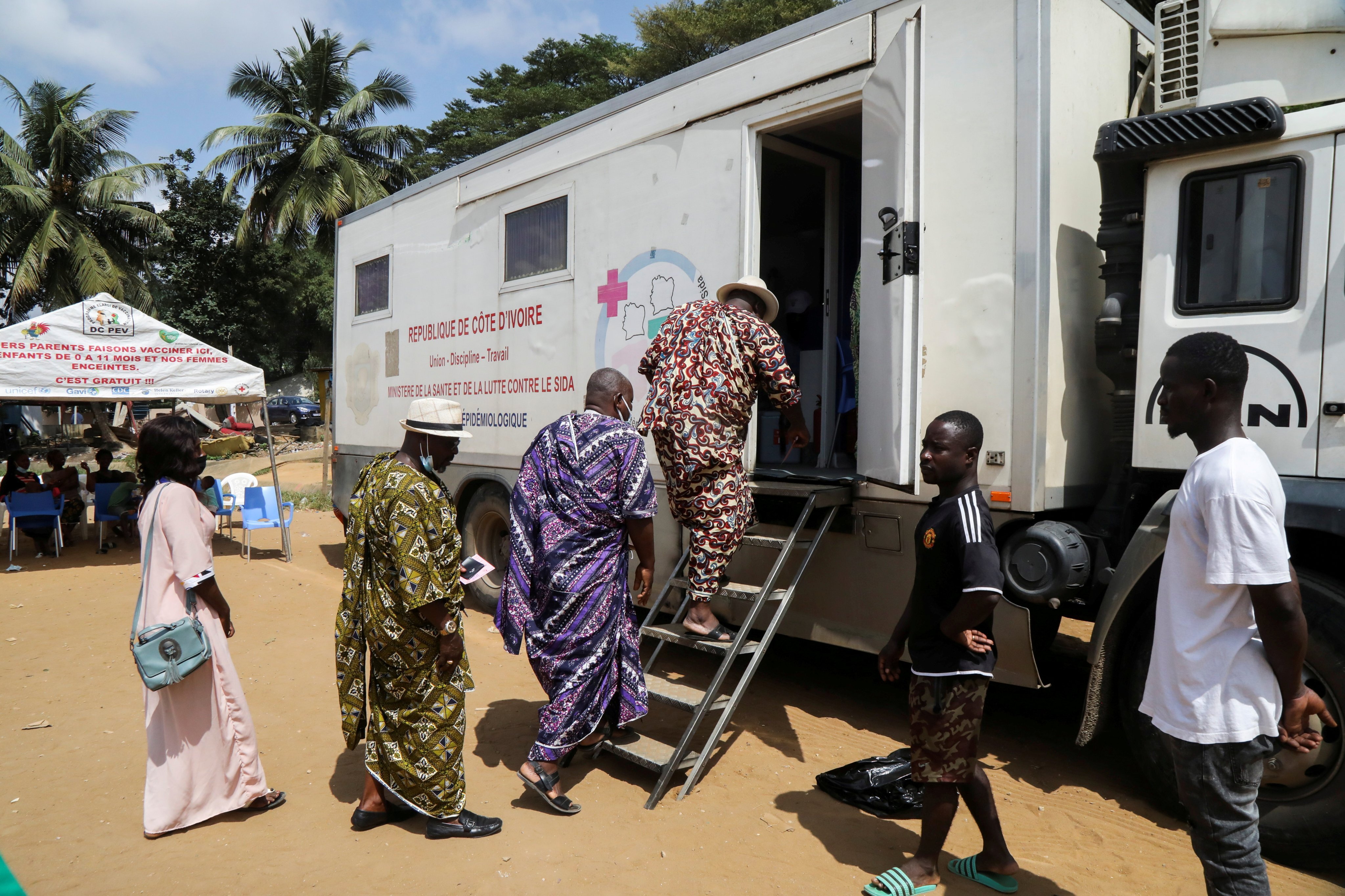 People enter a mobile vaccination centre to receive a Covid-19 vaccine in Abidjan, Ivory Coast, on September 23. Just 5 per cent of adults in low-income countries are vaccinated at a time when wealthy countries are giving booster shots and letting vaccine doses go to waste. Photo: Reuters