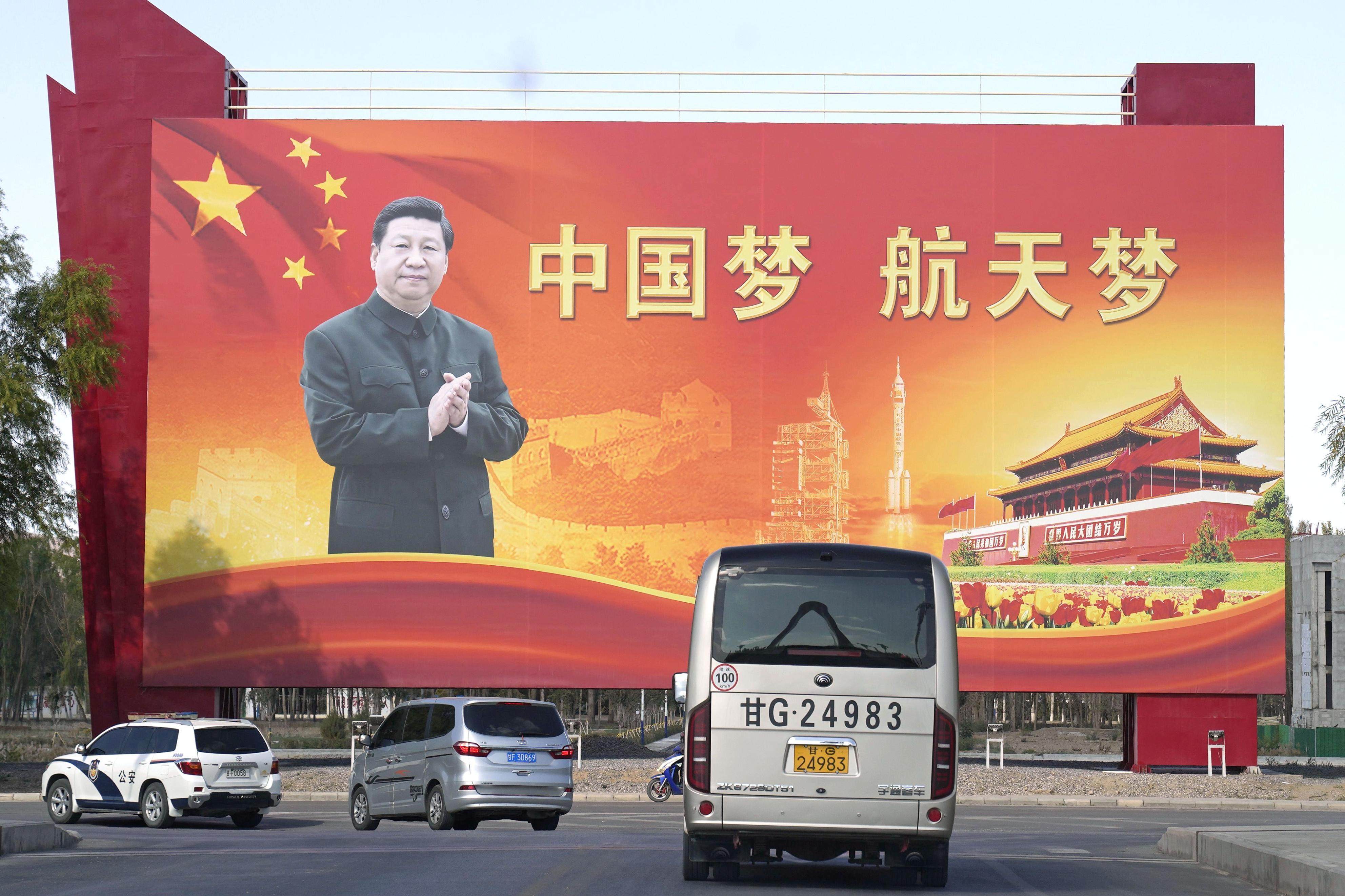 Chinese President Xi Jinping is seen on a billboard with the slogan “China dream. Space dream” at the Jiuquan Satellite Launch Centre in Gansu province on October 14. Photo: Kyodo