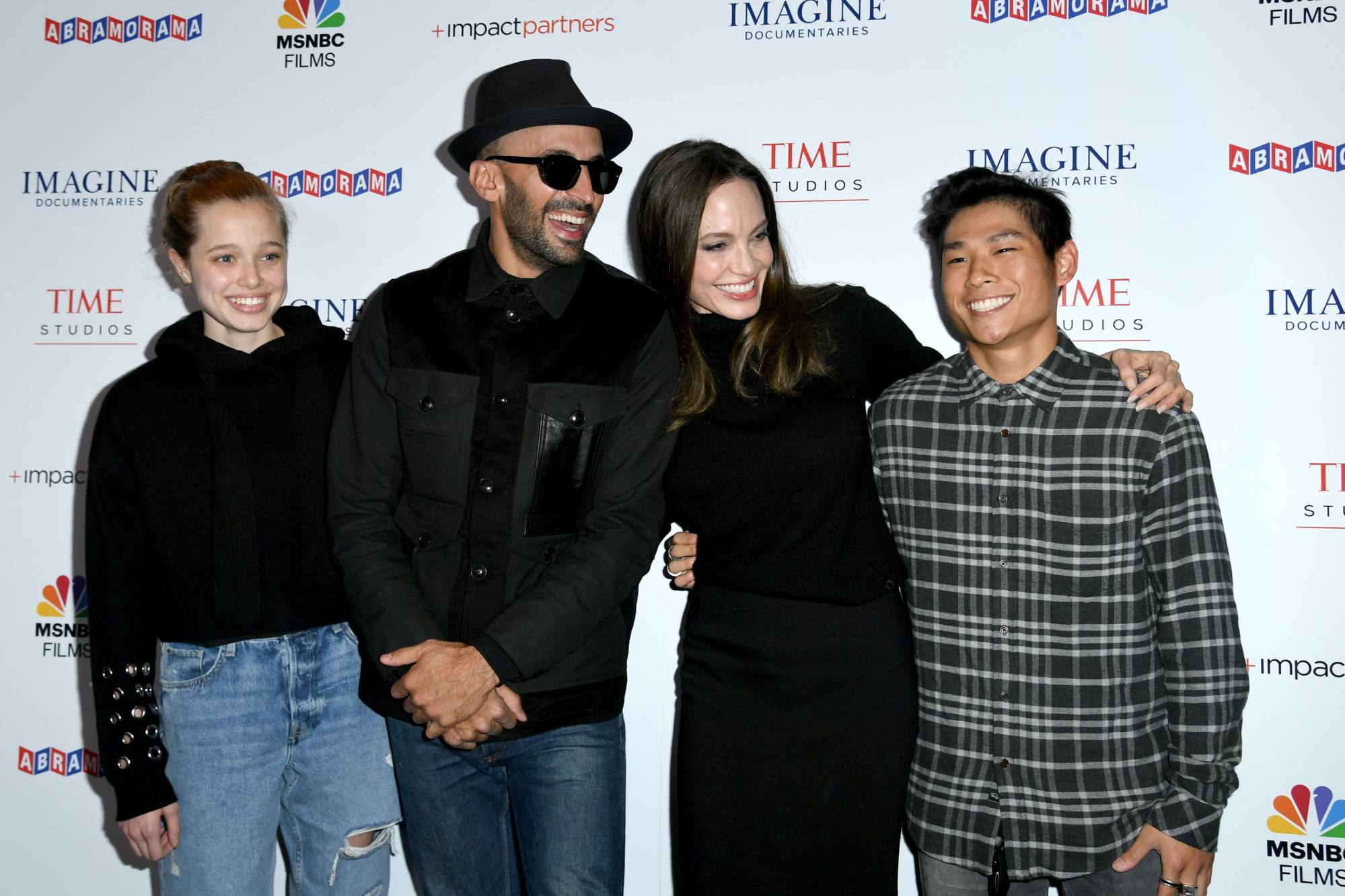 Shiloh Jolie-Pitt, street artist JR, actress Angelina Jolie and Pax Jolie-Pitt attend the premiere of Paper & Glue: A JR Project at the Museum Of Tolerance on November 18, in Los Angeles. Photo: Getty Images/AFP