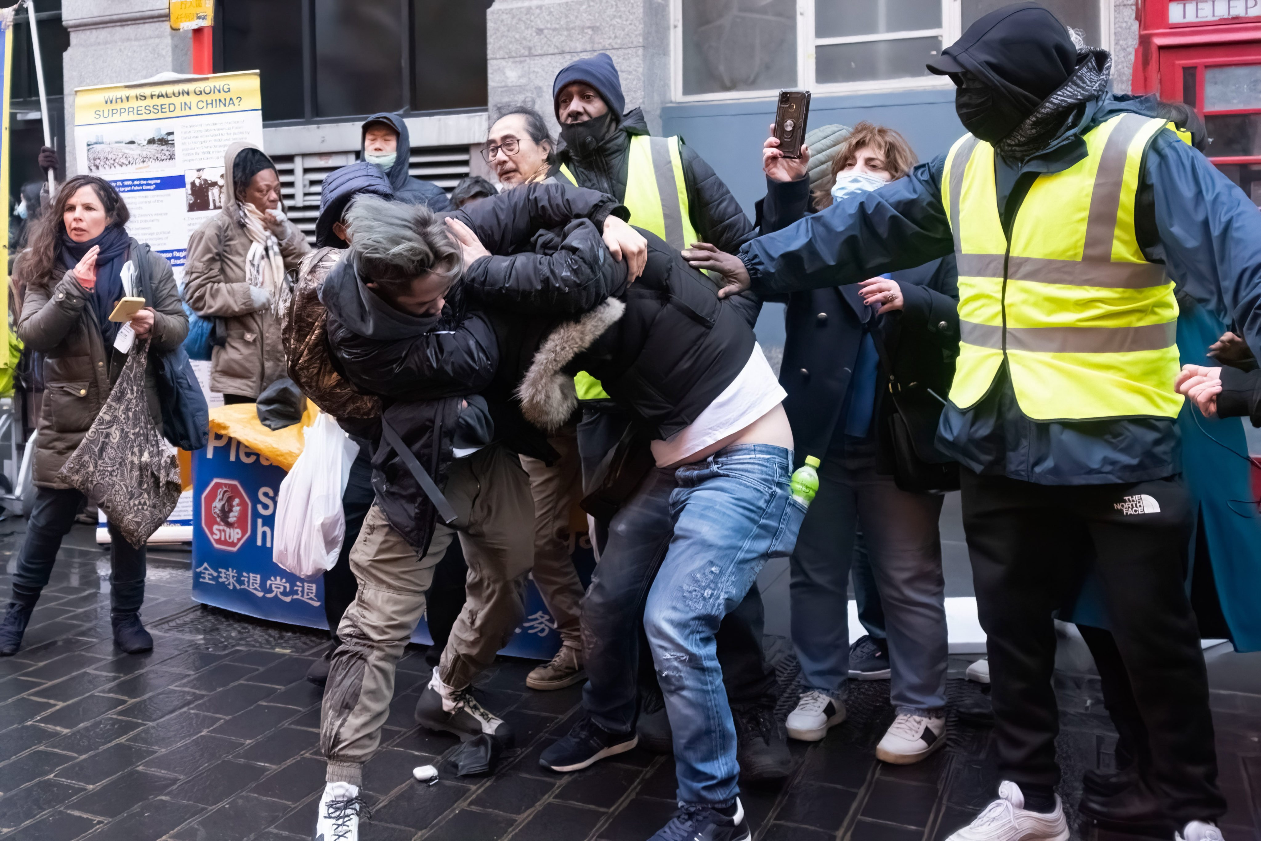 A scuffle breaks out between a pro-Beijing group and Hong Kong migrants during a rally in London’s Chinatown on Saturday. Photo: Getty Images

