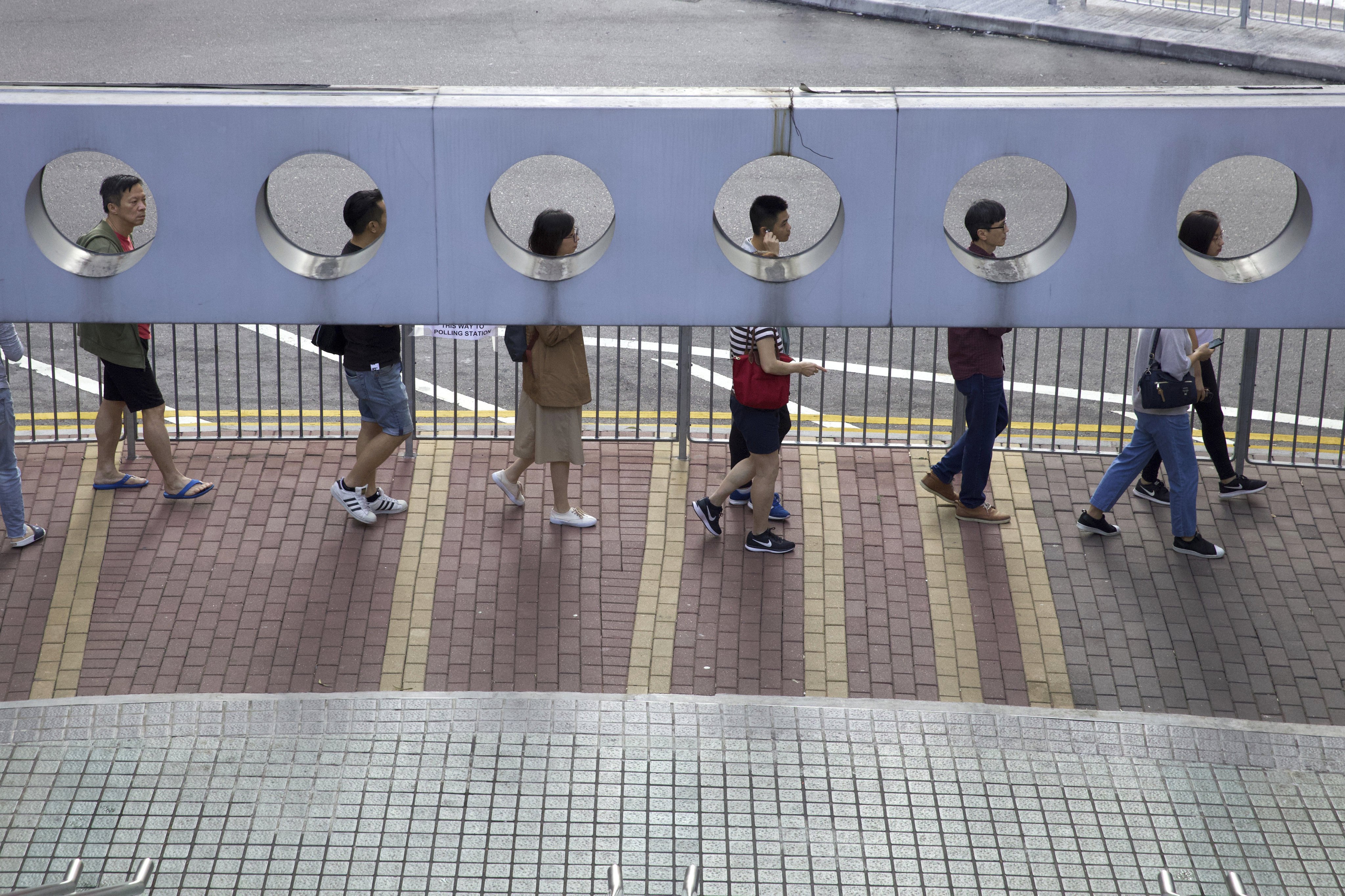 People line up to vote in Hong Kong on November 24, 2019. Photo: AP