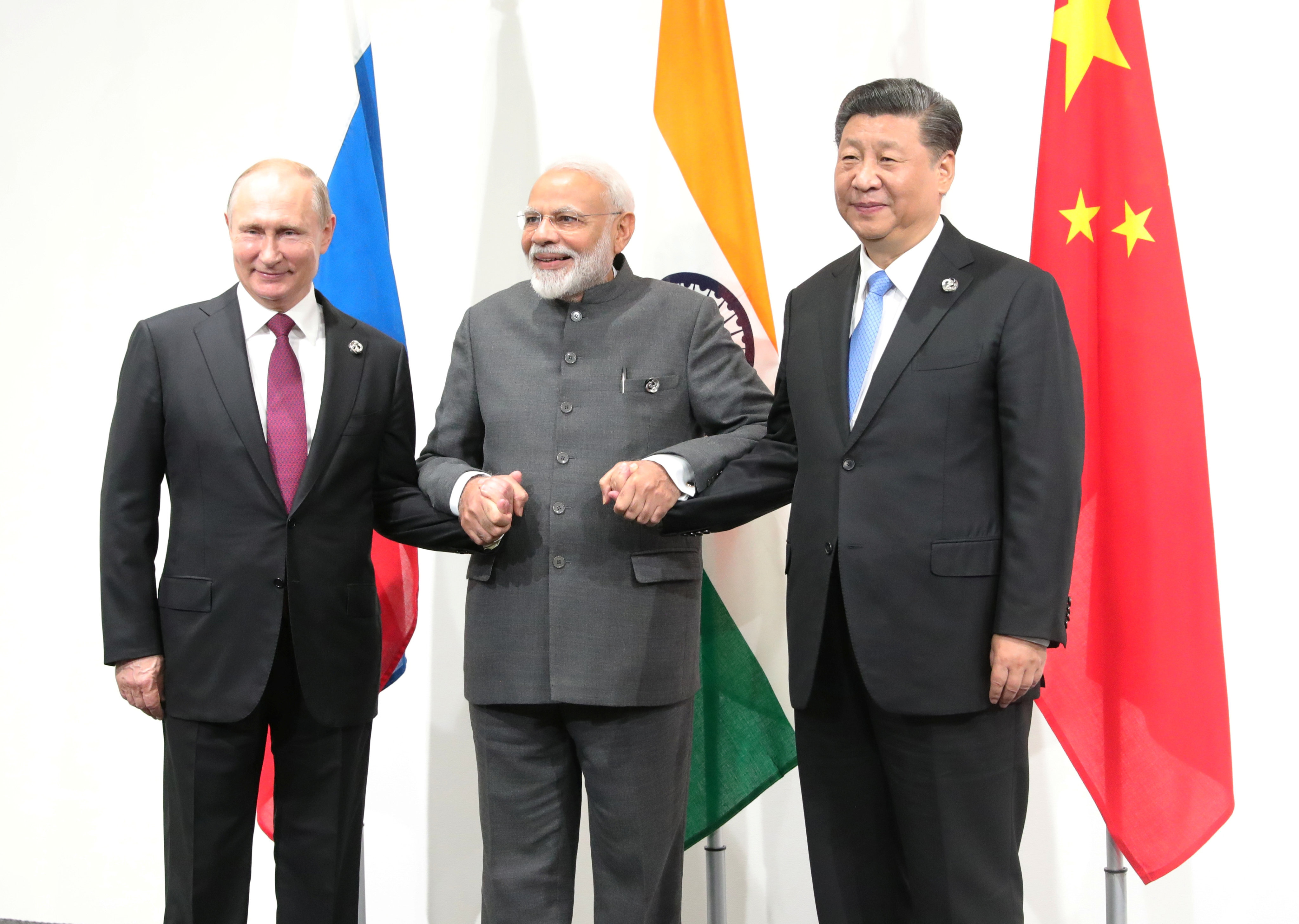 Russian President Vladimir Putin (left), Indian Prime Minister Narendra Modi (centre) and Chinese President Xi Jinping meet on the sidelines of the G20 summit in Osaka, Japan, on June 28, 2019. While India has been drawing closer to the US, it has signalled its support of China hosting the Winter Olympics and continues to buy military equipment from Russia. Photo:Reuters
