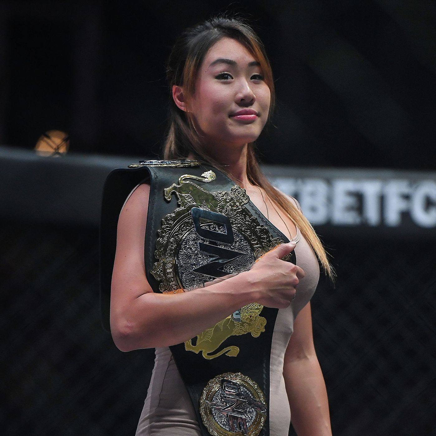 Angela Lee holds her ONE atomweight title inside the Circle. Photos: ONE Championship