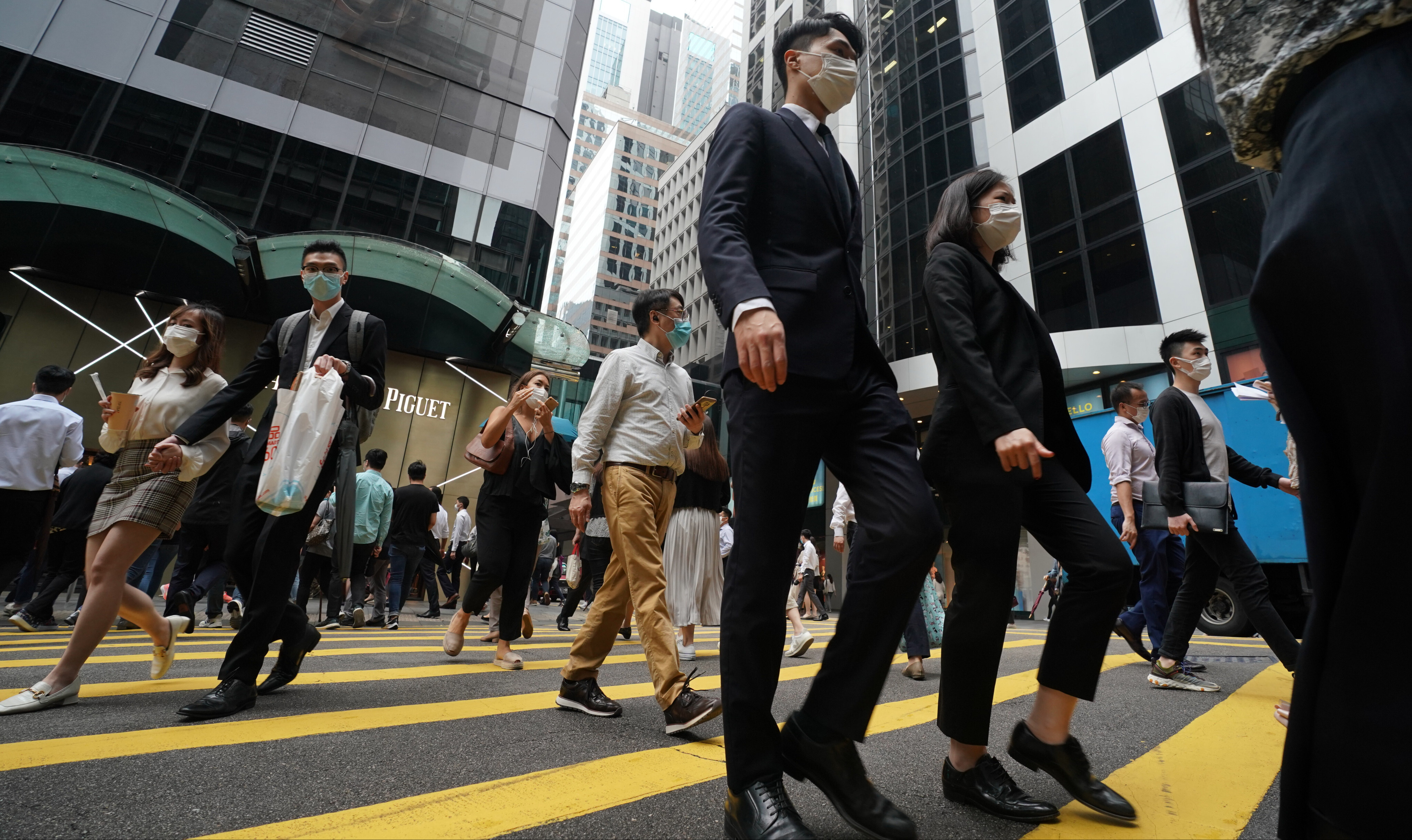 People head to work in Central on May 3, 2021. Allowing the free flow of talent across the region will mean more opportunities for young people and a swifter post-pandemic recovery. Photo: Felix Wong