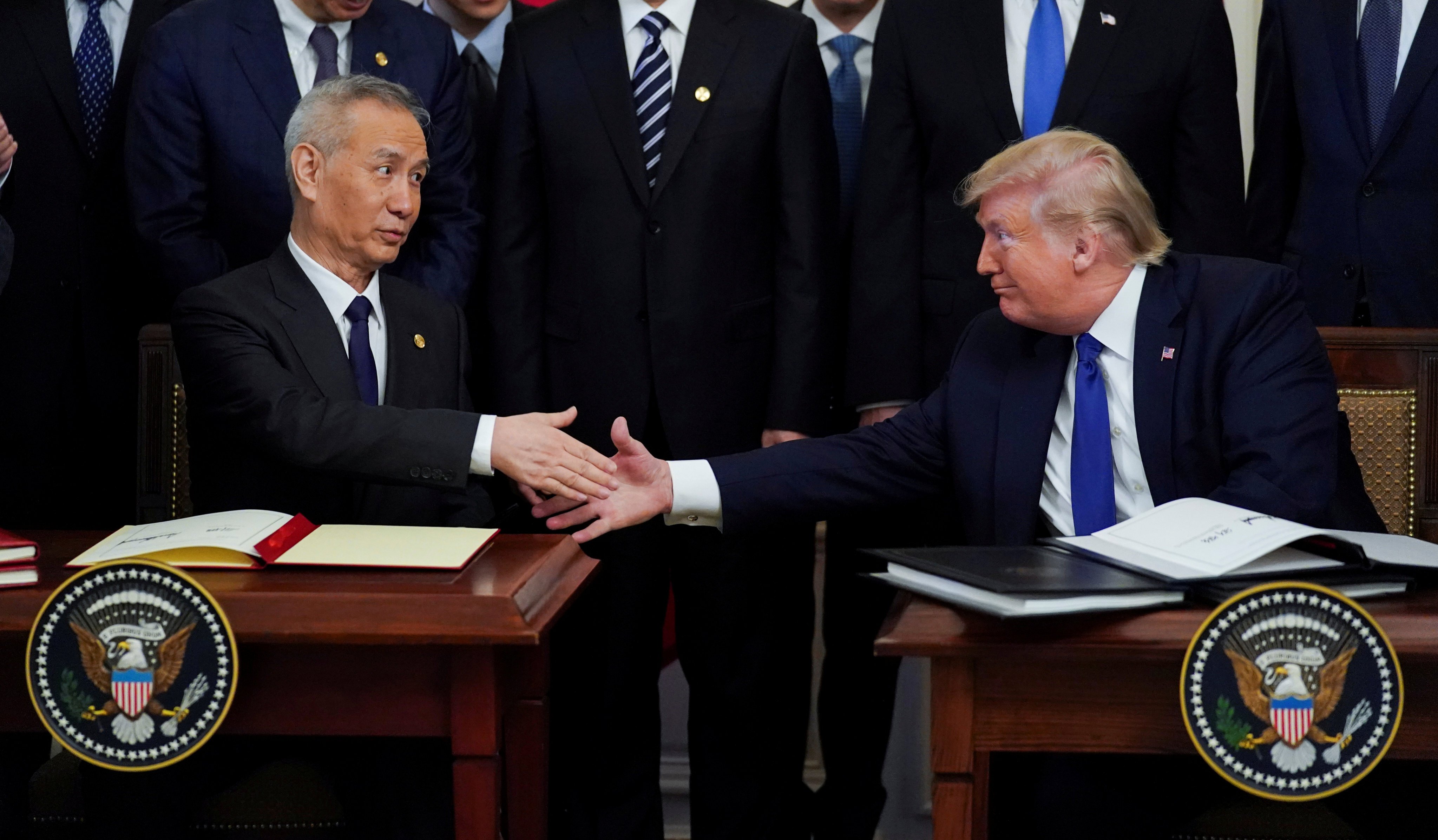 Vice-Premier Liu He (left) and then US president Donald Trump shake hands after signing phase one of the US-China trade agreement during a ceremony in the East Room of the White House in Washington on January 15, 2020. Photo: Reuters