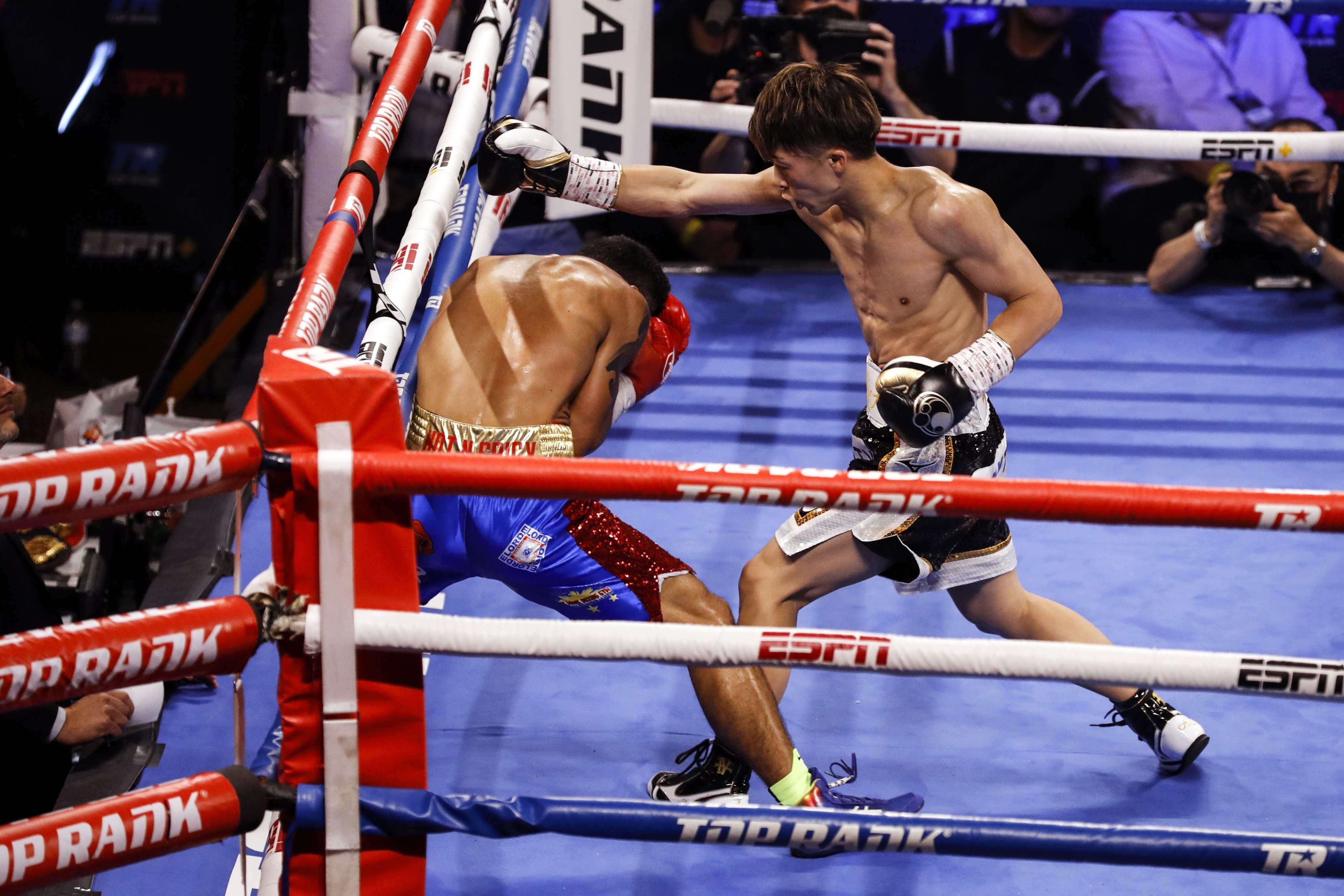 Naoya Inoue (R) of Japan in action against Michael Dasmarinas (L) of the Philippines during their 12 rounds WBA/IBF Bantamweight Title fight at The Theater at Virgin Hotels in Las Vegas on 19 June 2021. Photo: EPA-EFE