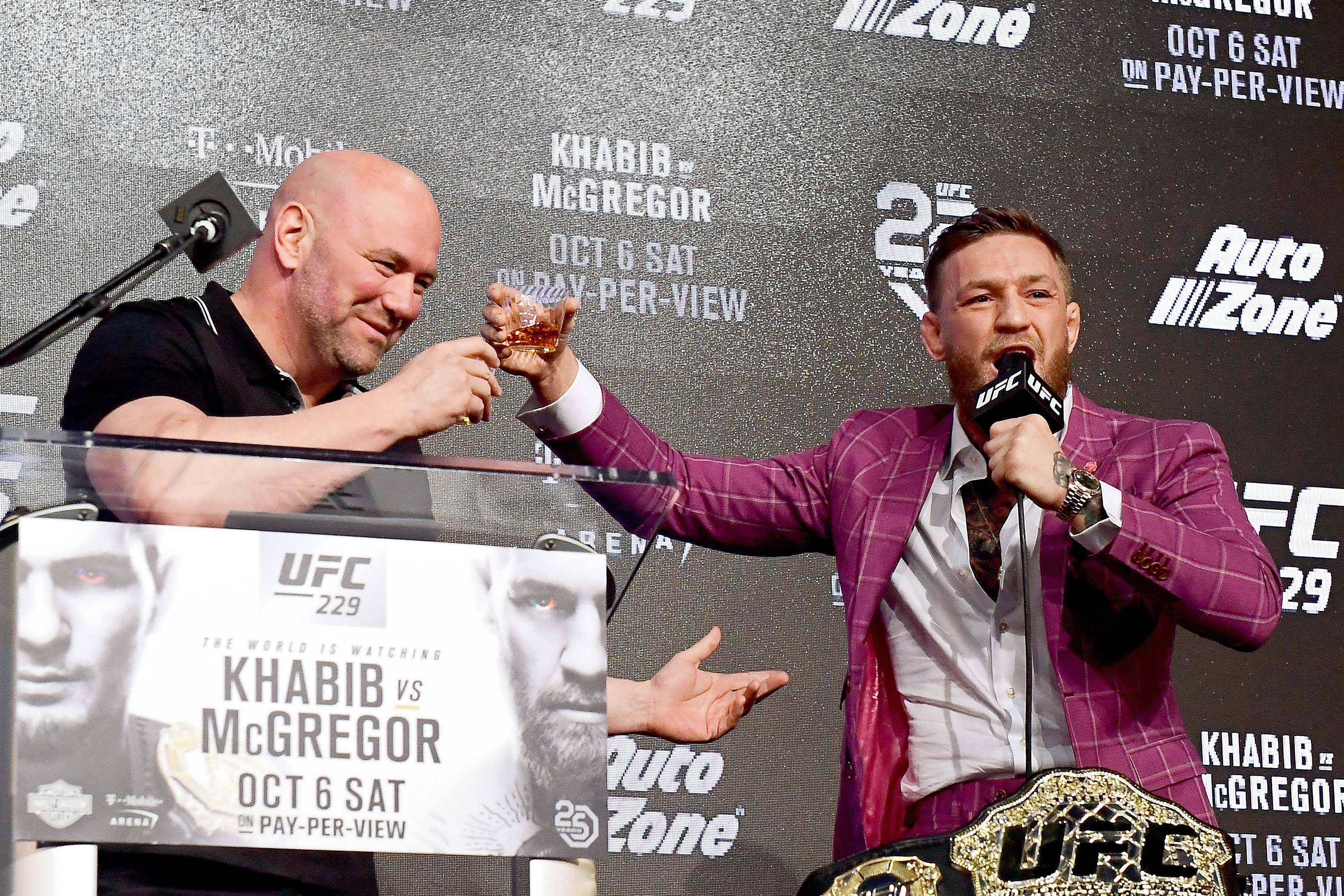 Conor McGregor shares his Irish whiskey with UFC president Dana White. Photo: AFP