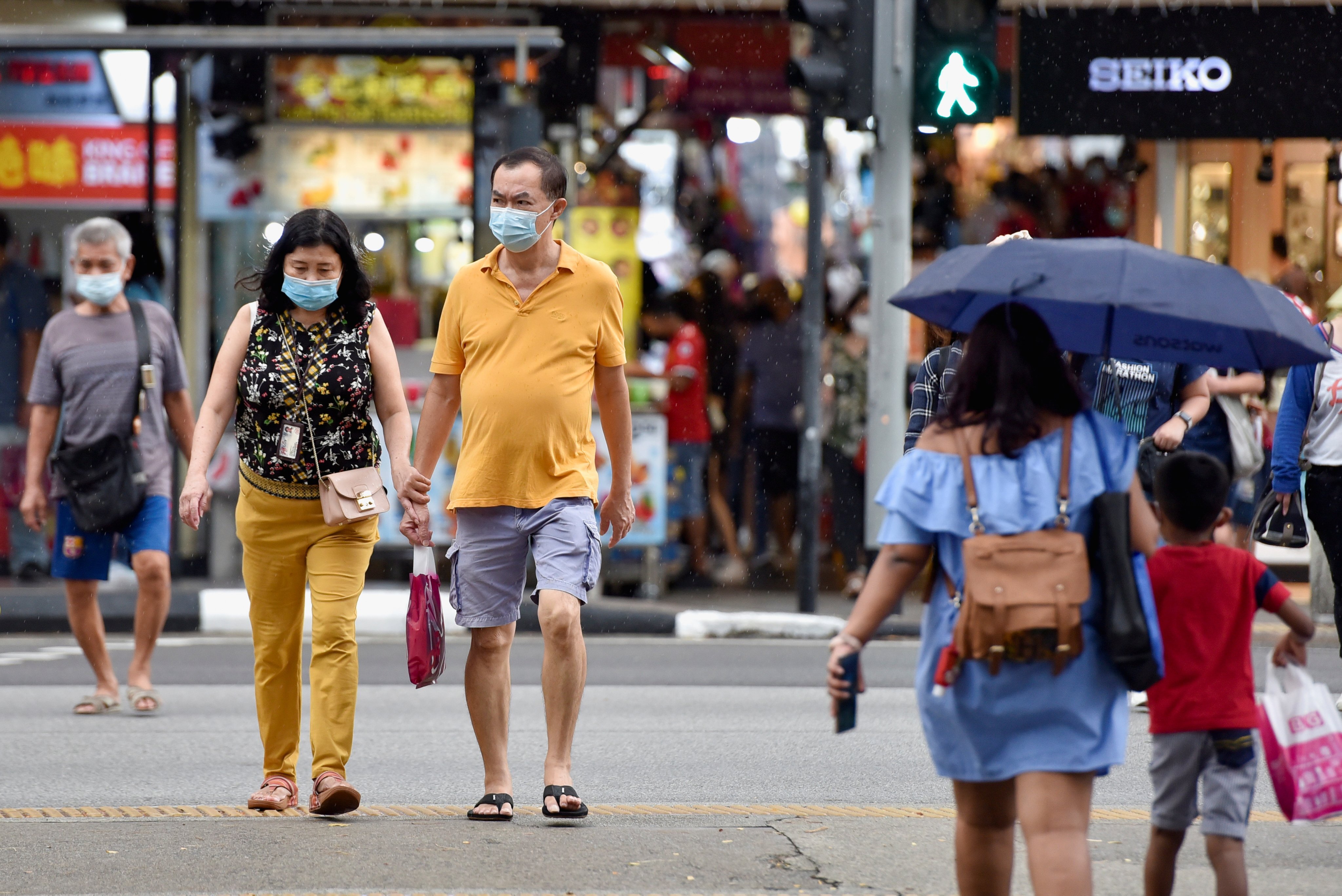 Pedestrians in Singapore. Photo: Reuters