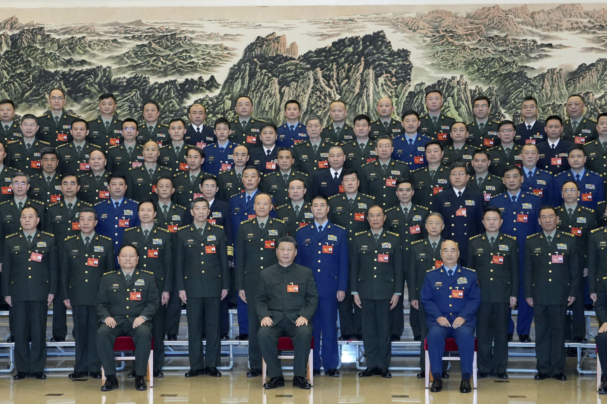 Chinese President Xi Jinping (centre) poses for photos with representatives attending a conference on military-talent-related work in Beijing, China on November 26. Photo: Xinhua via AP