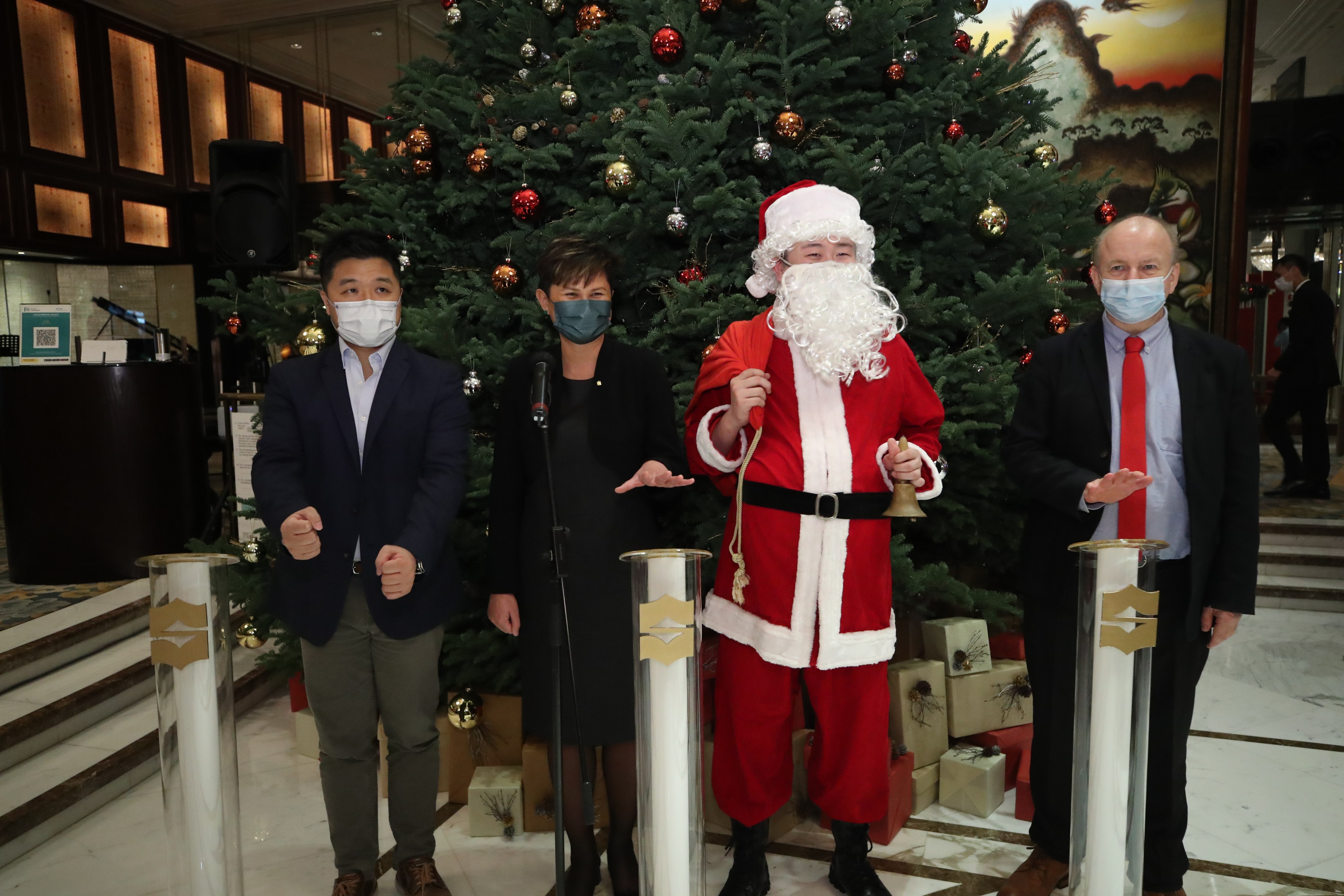 Kowloon Shangri-La hotel manager Ghislaine Lê (second left) prepares to light the hotel’s Christmas tree last week, alongside the Post’s senior CSR manager Lawrence Wong (left) and RTHK English programming head Hugh Chiverton (right). Photo: Edmond So
