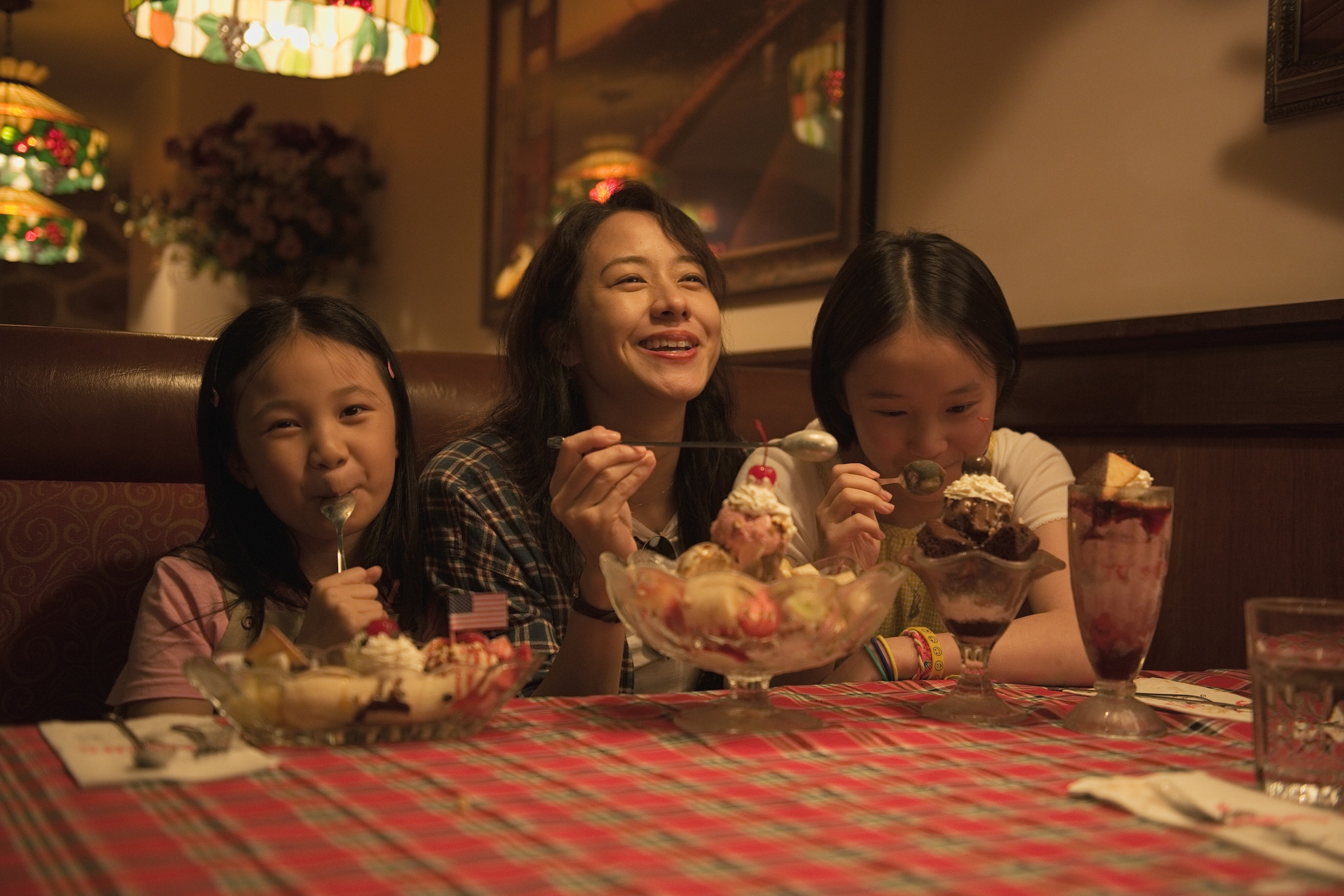 Karena Lam (centre) plays a mother suffering from cancer in American Girl.