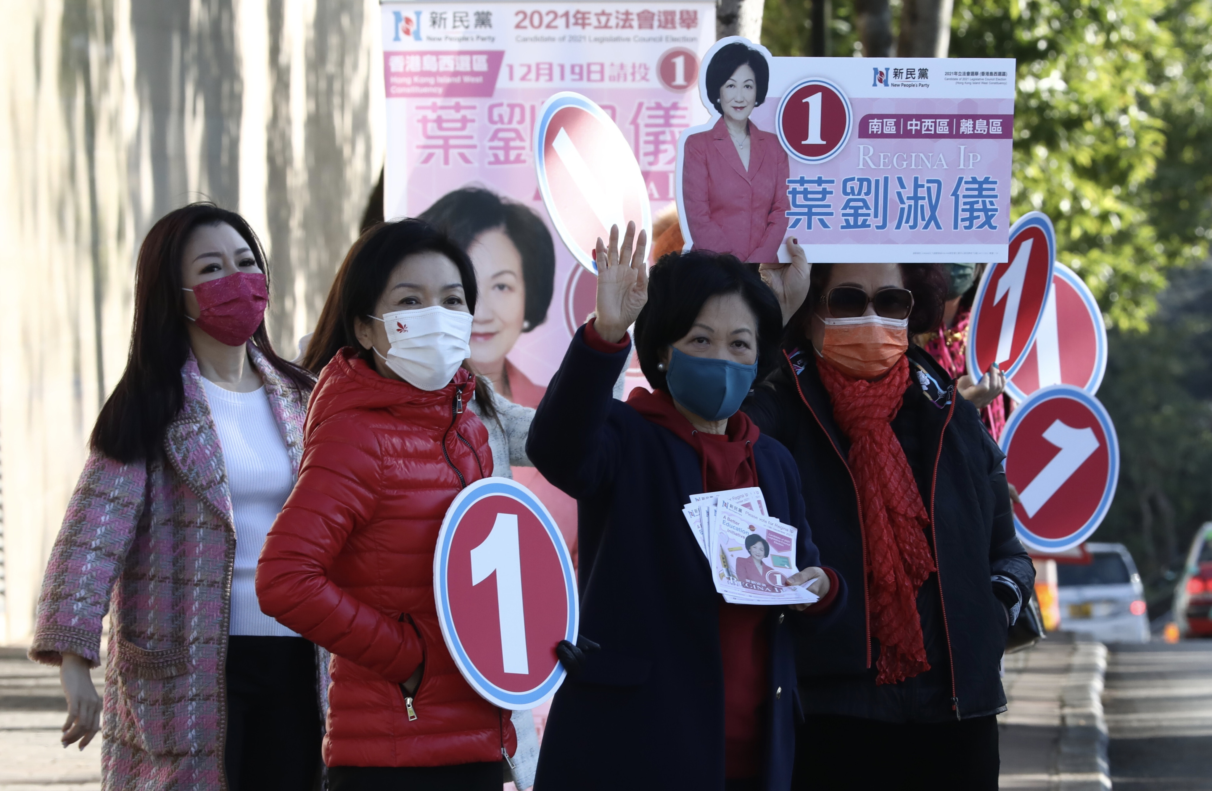 Regina Ip (second from right) and her supporters canvass for votes at The Peak on Friday. Photo: Jonathan Wong