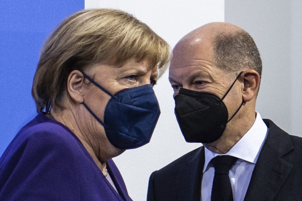 German Chancellor Angela Merkel (L) and her successor Olaf Scholz. Photo: AFP