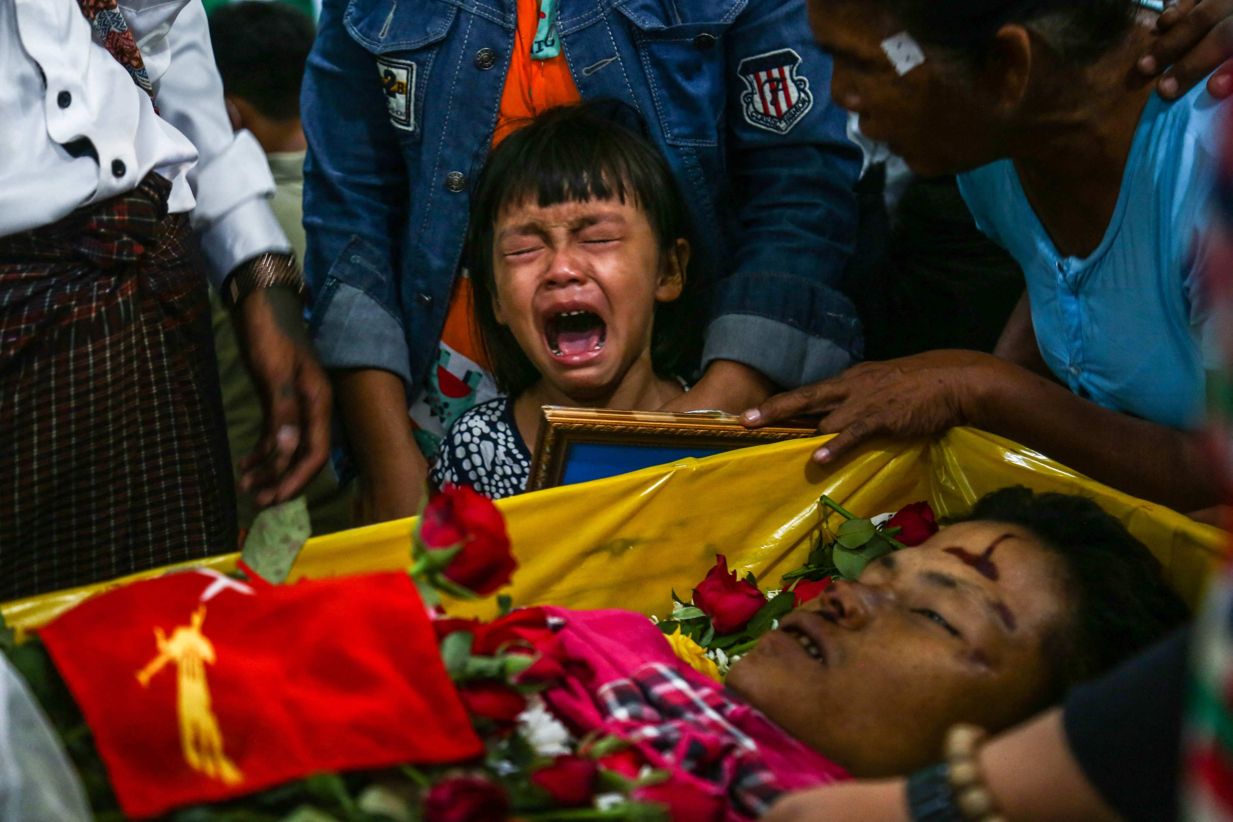 The daughter of a protester who died in March 2021 during a demonstration against Myanmar’s military coup, cries during her father’s funeral. There is concern that the sale of the Myanmar branch of Norway telecoms firm Telenor could lead to potentially dangerous call data relating to millions of people being seen by the junta. Photo: AFP