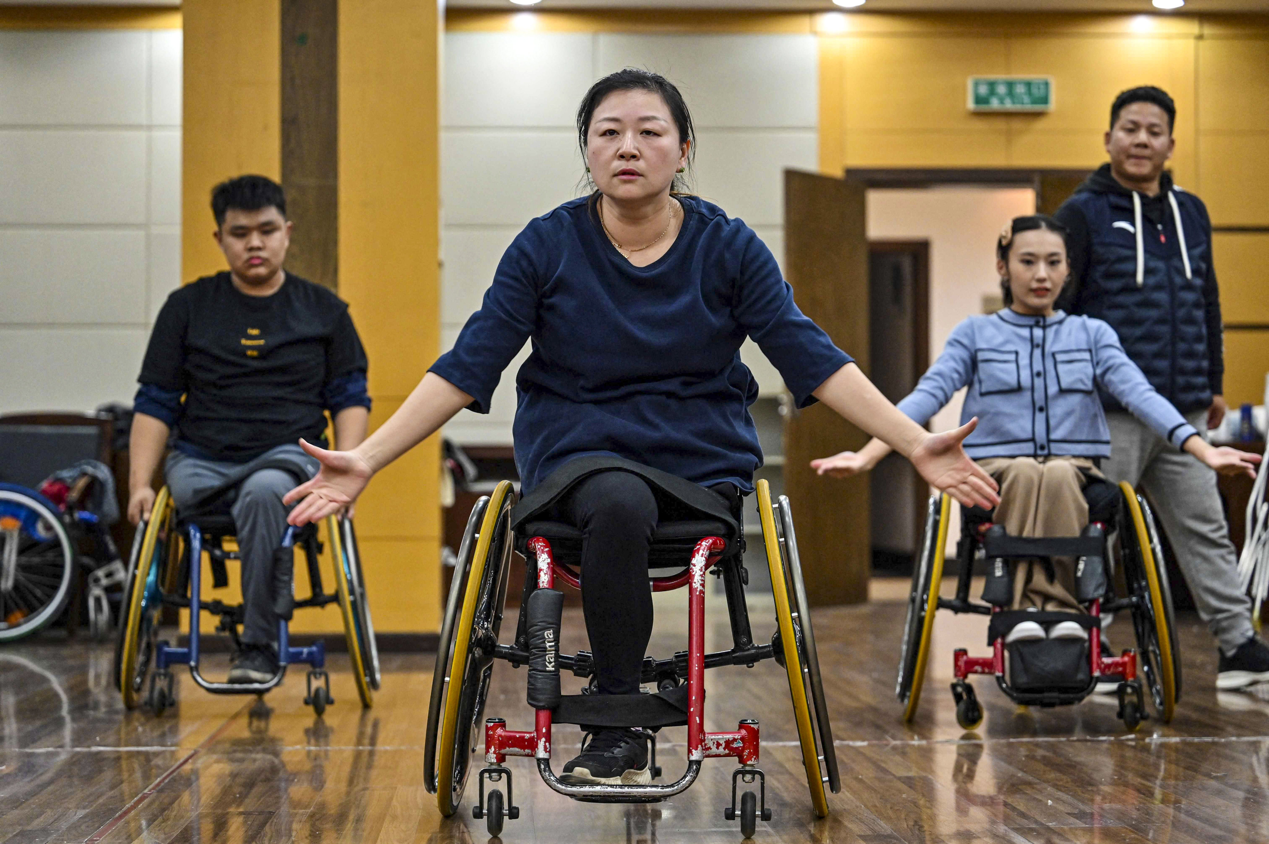 Wheelchair dancer Shao Yue (centre) practises with the Shanghai Oriental Pearl TV Tower Handicapped Art Troupe on the outskirts of Shanghai. Photo: AFP