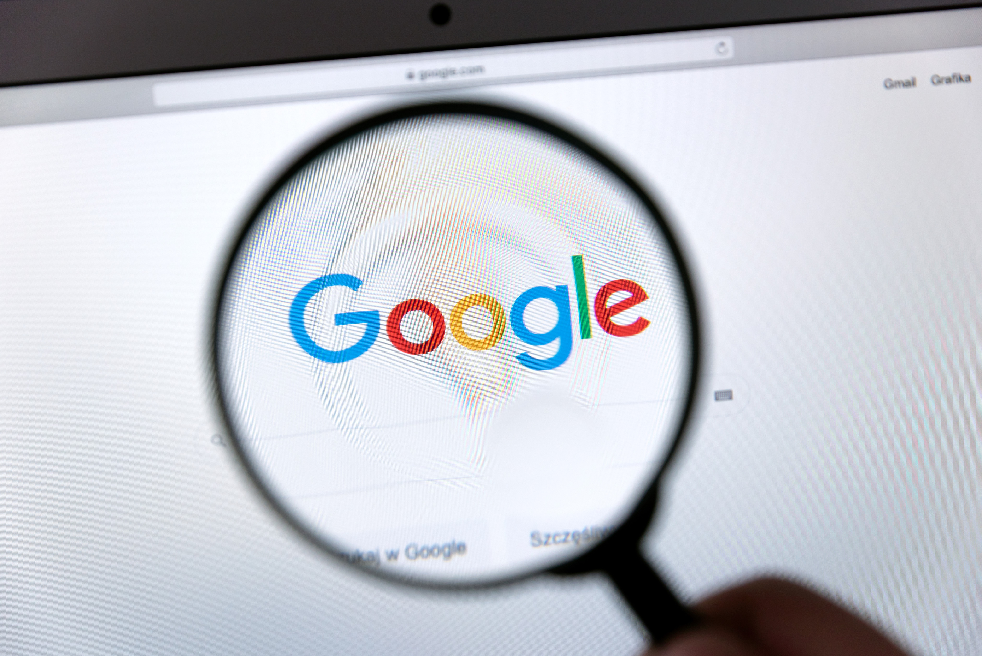 Google logo through a magnifying glass. Photo: Shutterstock