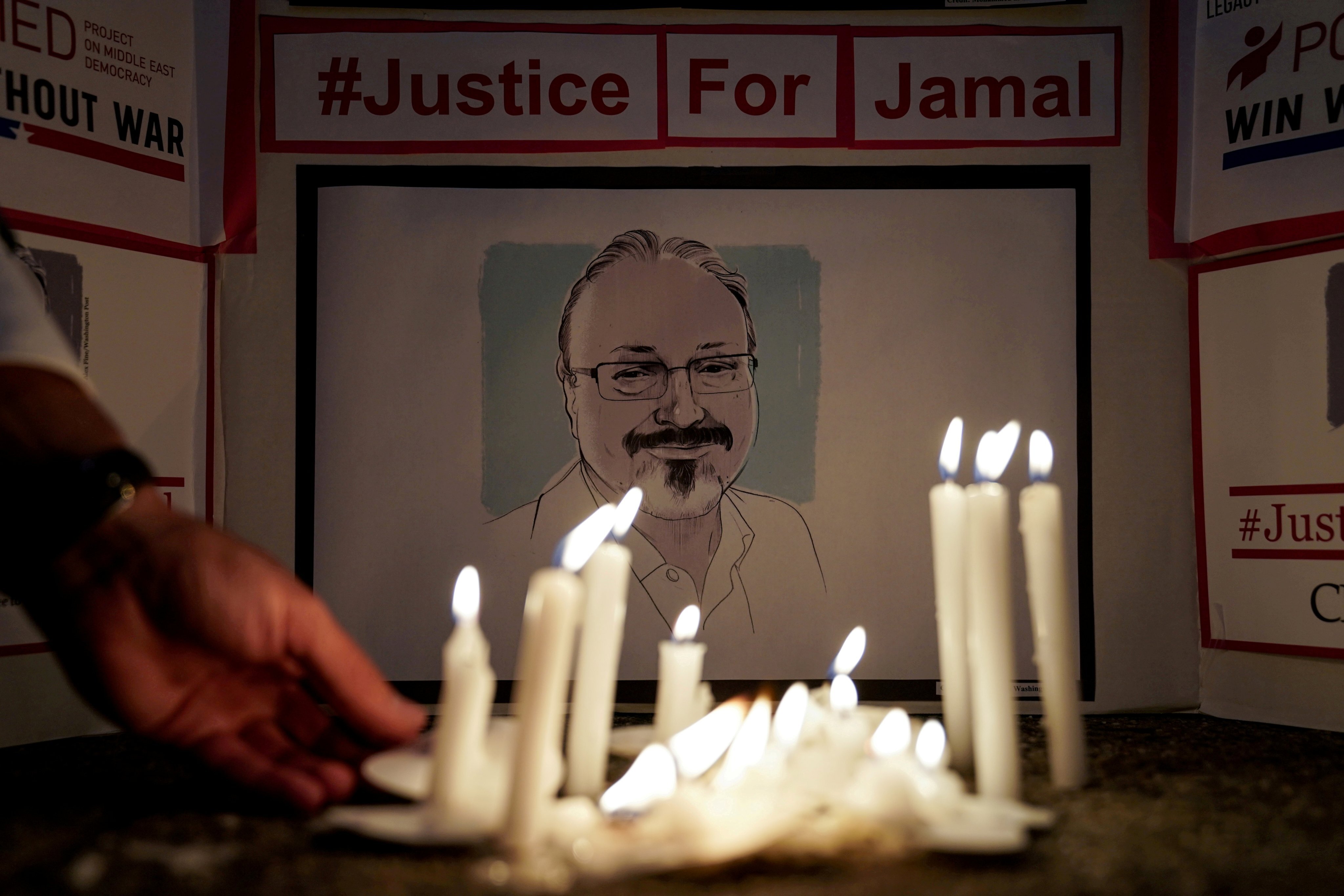 The Committee to Protect Journalists and other press freedom activists hold a candlelight vigil in front of the Saudi embassy in October 2019 to mark the anniversary of the killing of Jamal Khashoggi. Photo: Reuters