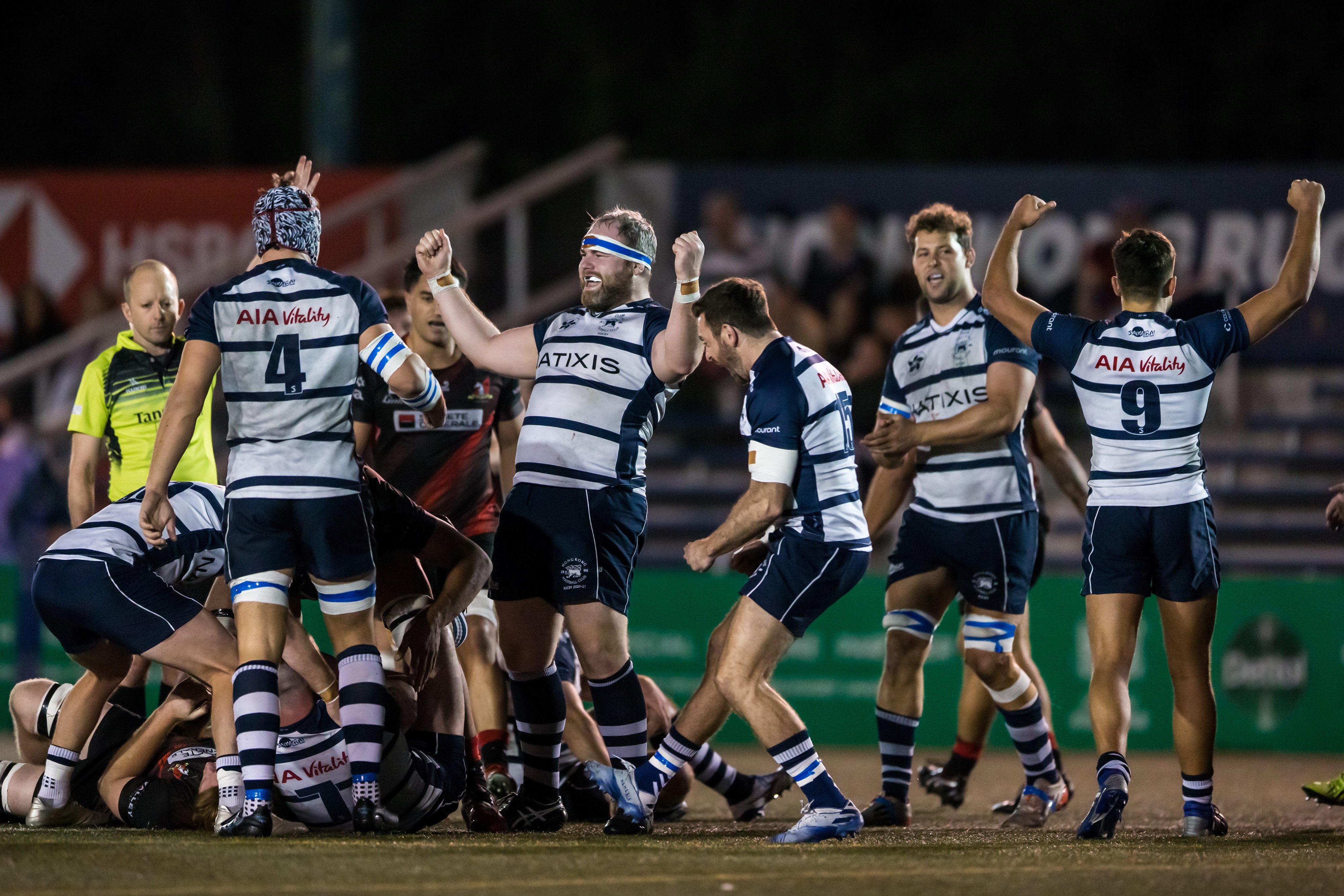 Hong Kong Football Club player Ronan Donnelly celebrates with teammates after scoring a try against Valley in the Hong Kong men’s rugby Premiership at Hong Kong Stadium. Photo: Phoebe Leung   