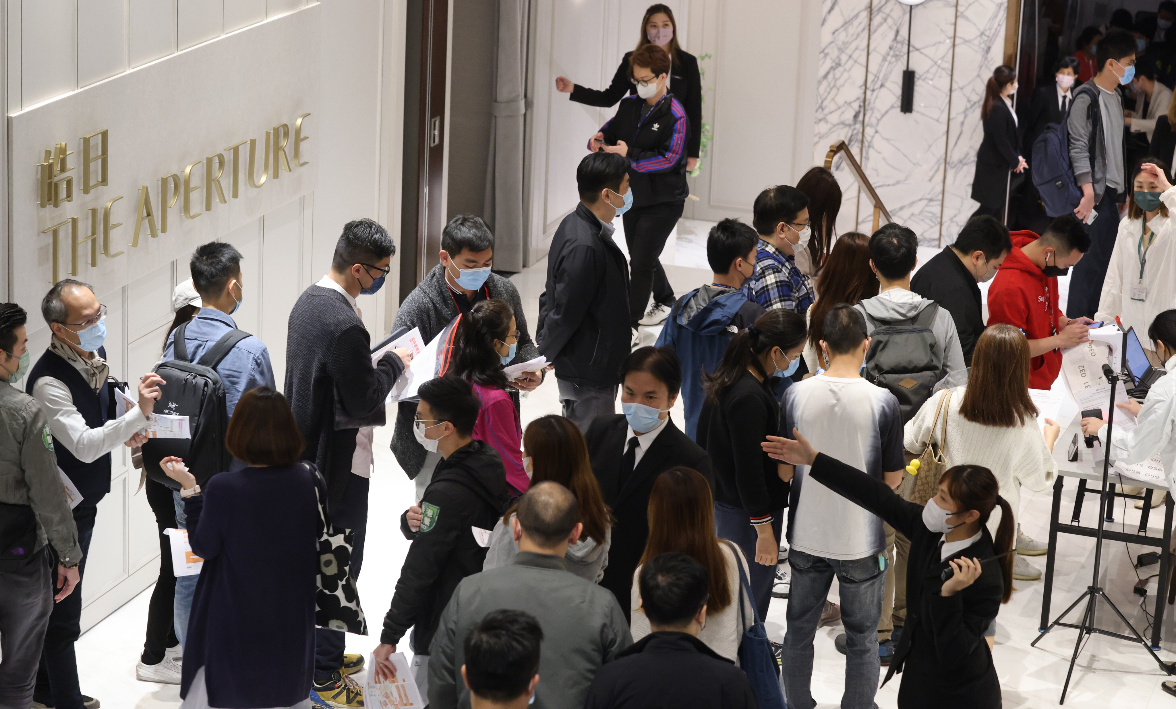 People lining up for The Aperture development, built by Hang Lung Properties, in Kowloon Bay on 11 December 2021. Photo: May Tse