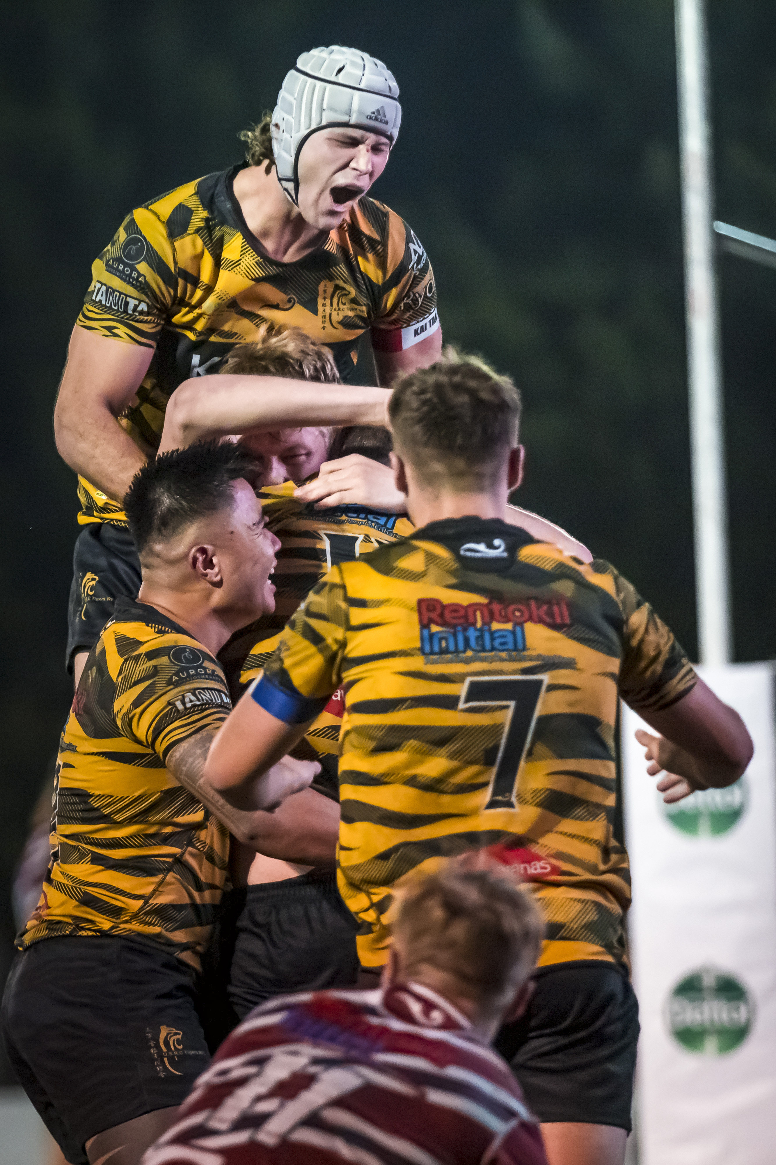 USRC Tigers captain Lawrence Miller (silver headgear) celebrates his side’s win over Kowloon. Photo: Handout