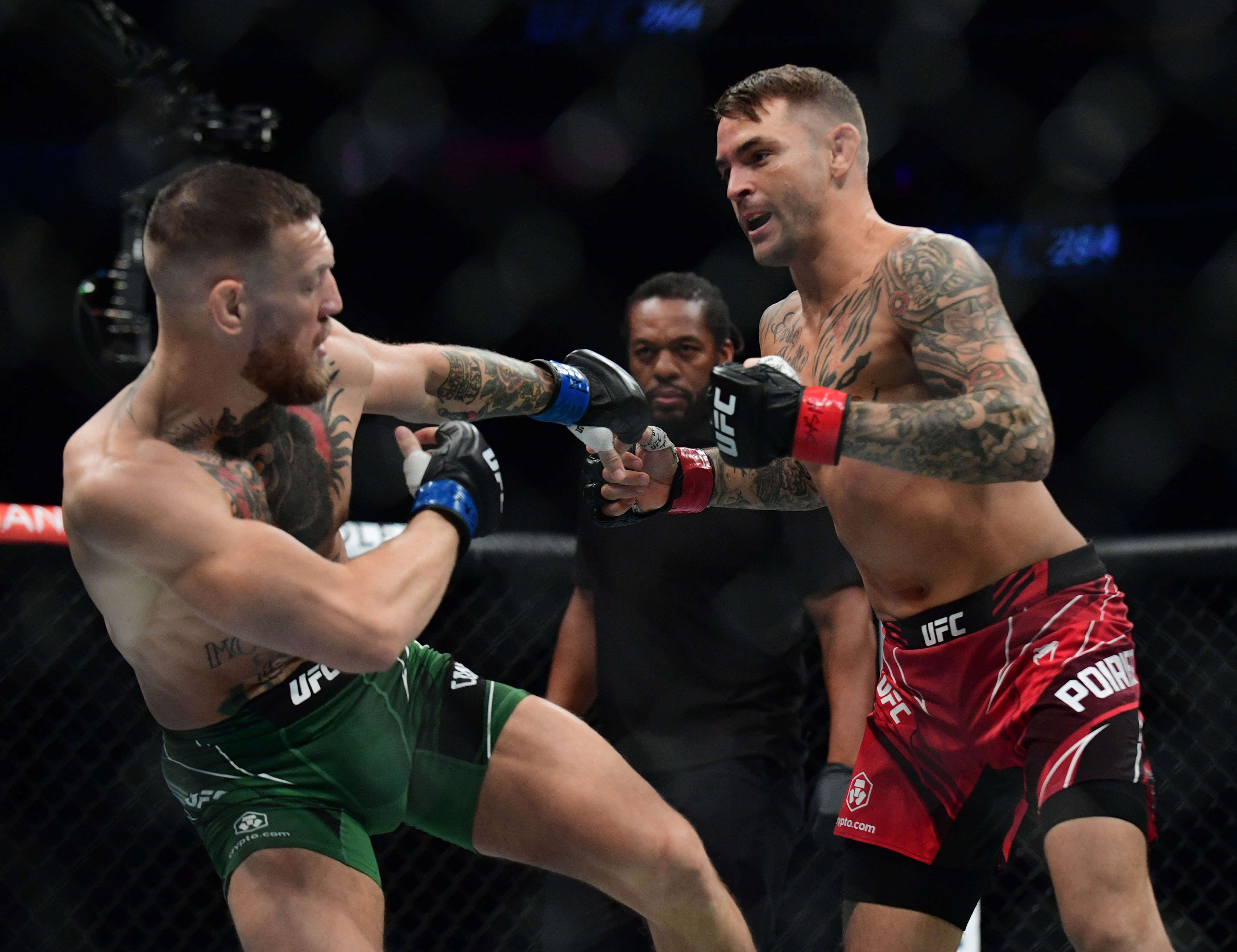 Dustin Poirier swarms Conor McGregor at UFC 264. Photo: Gary A. Vasquez/USA TODAY Sports.