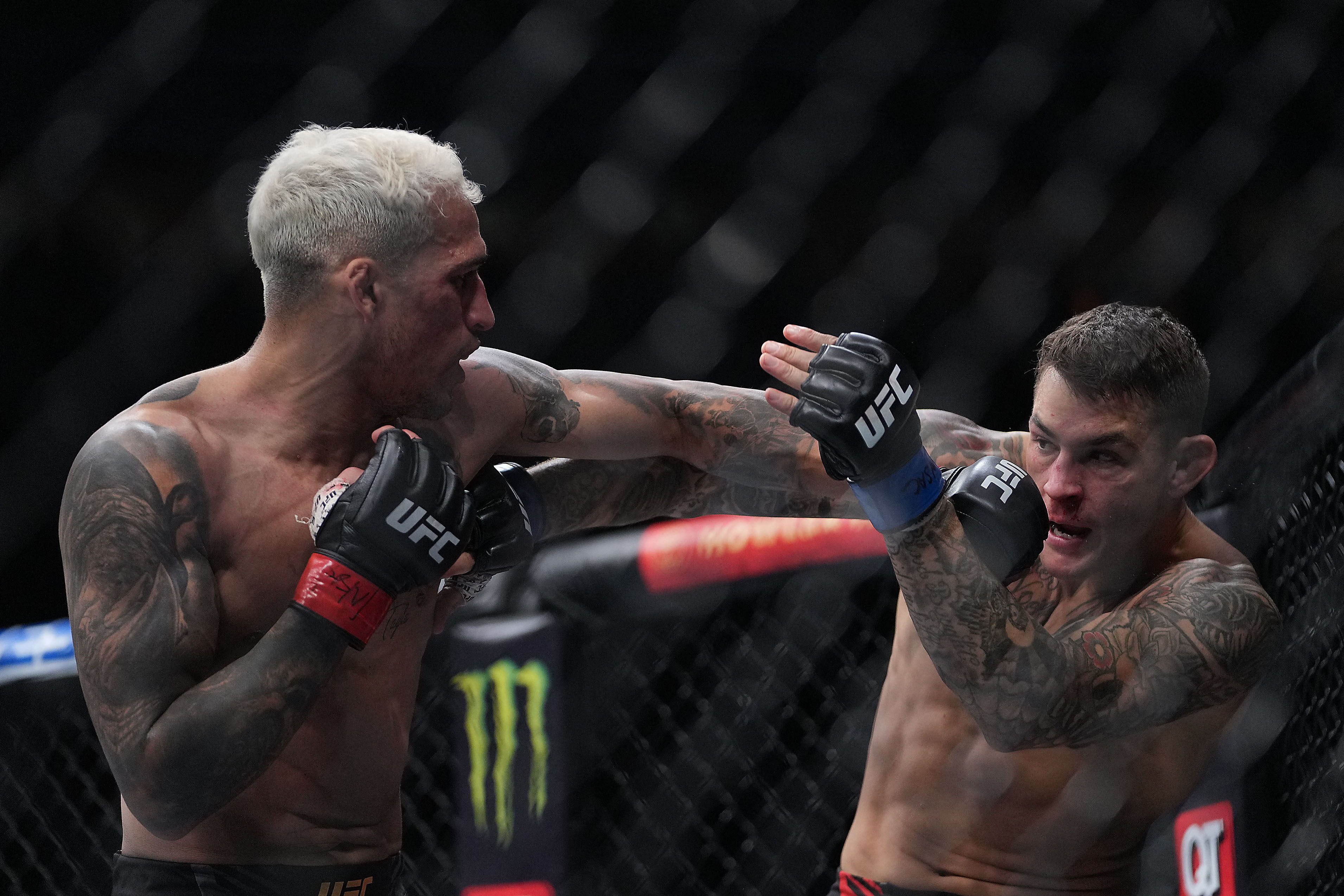 Charles Oliveira moves in with a hit against Dustin Poirier at UFC 269. Photo: Stephen R Sylvanie/USA TODAY Sports