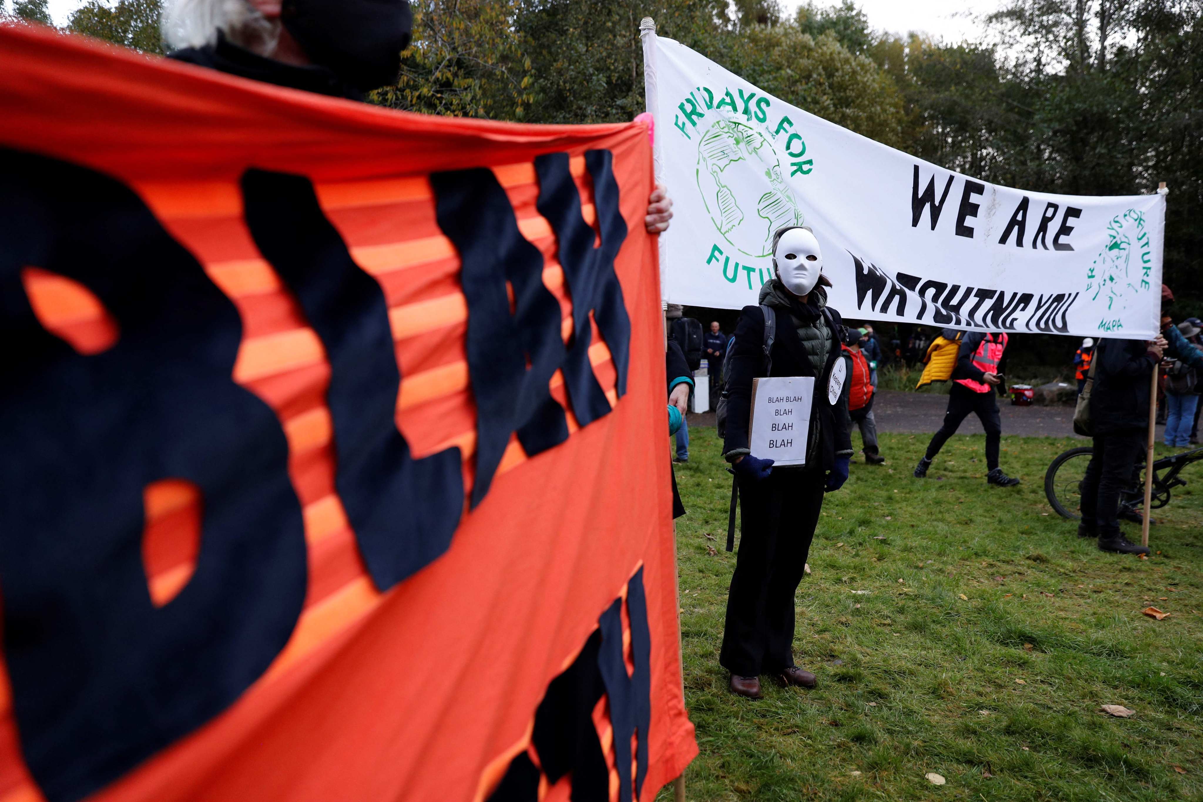 Climate activists hold placards as world leaders meet at the COP26 UN Climate Summit in Glasgow on November 1. Photo: AFP