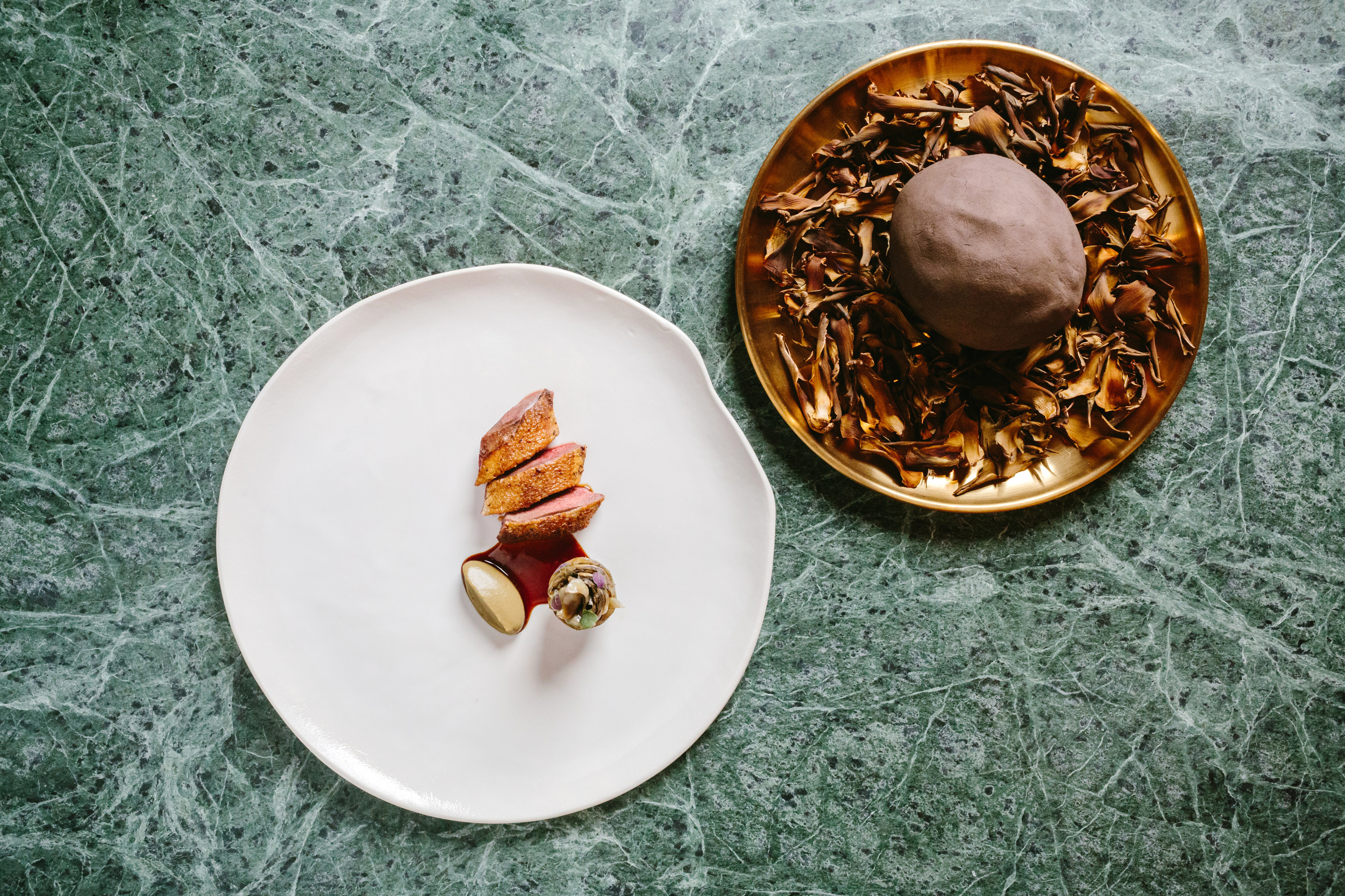 An Estro, the pigeon is “a performance on a plate with the bird wrapped in fig leaves and cooked in clay, and the chef opens it table”, writes Lisa Cam. Photo: Estro