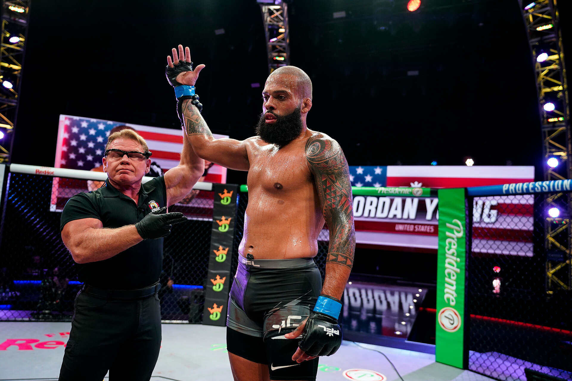 Jordan Young’s arm is raised in victory after beating Omari Akhmedov. Photo: PFL