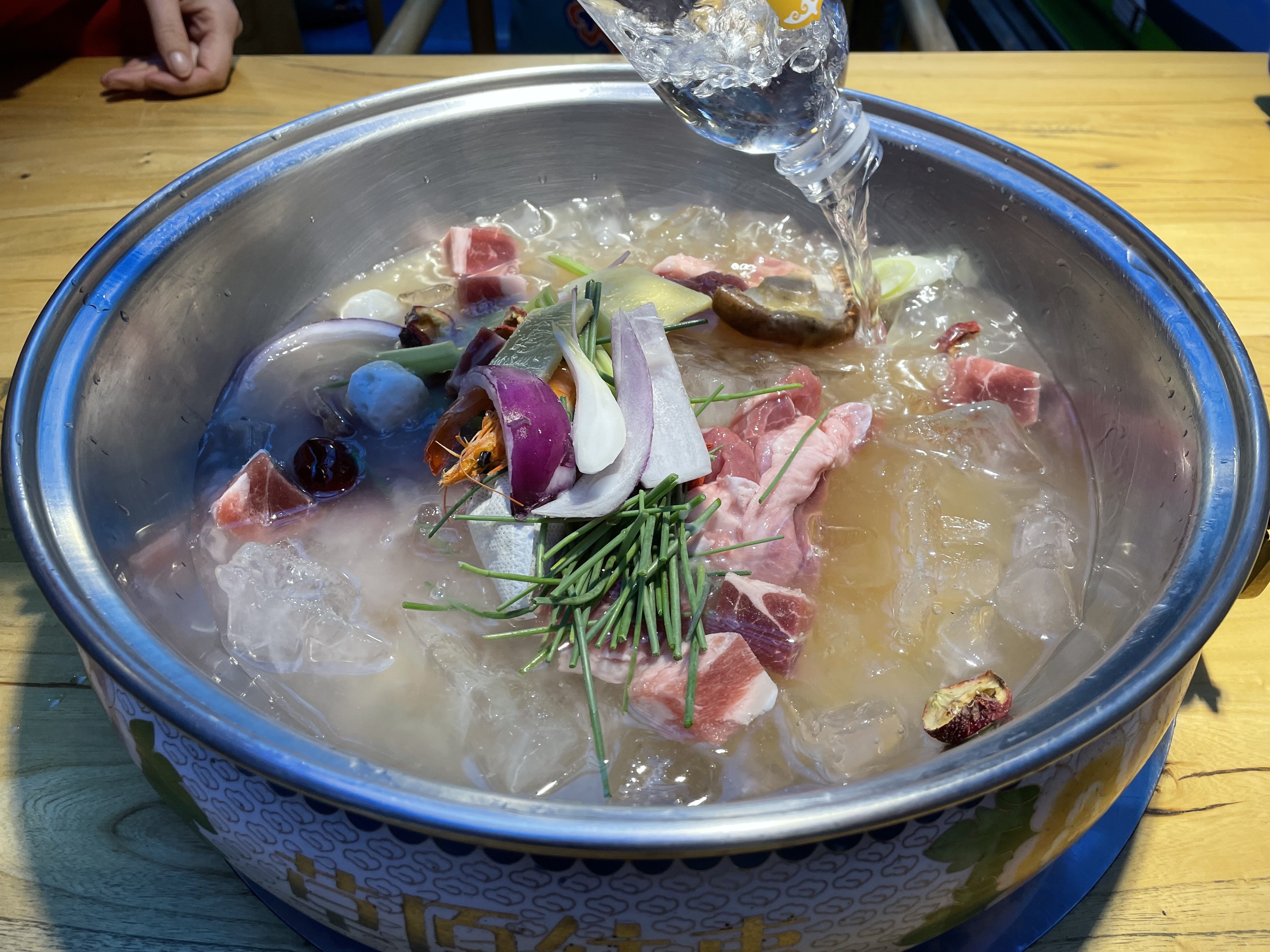 Lamb hotpot is a popular dish in northern China during the winter months. At Caoyuan Wangshi, a Mongolian specialist lamb hotpot chain, diced lamb cubes are served with ice to keep the meat fresh. Photo: Elaine Yau