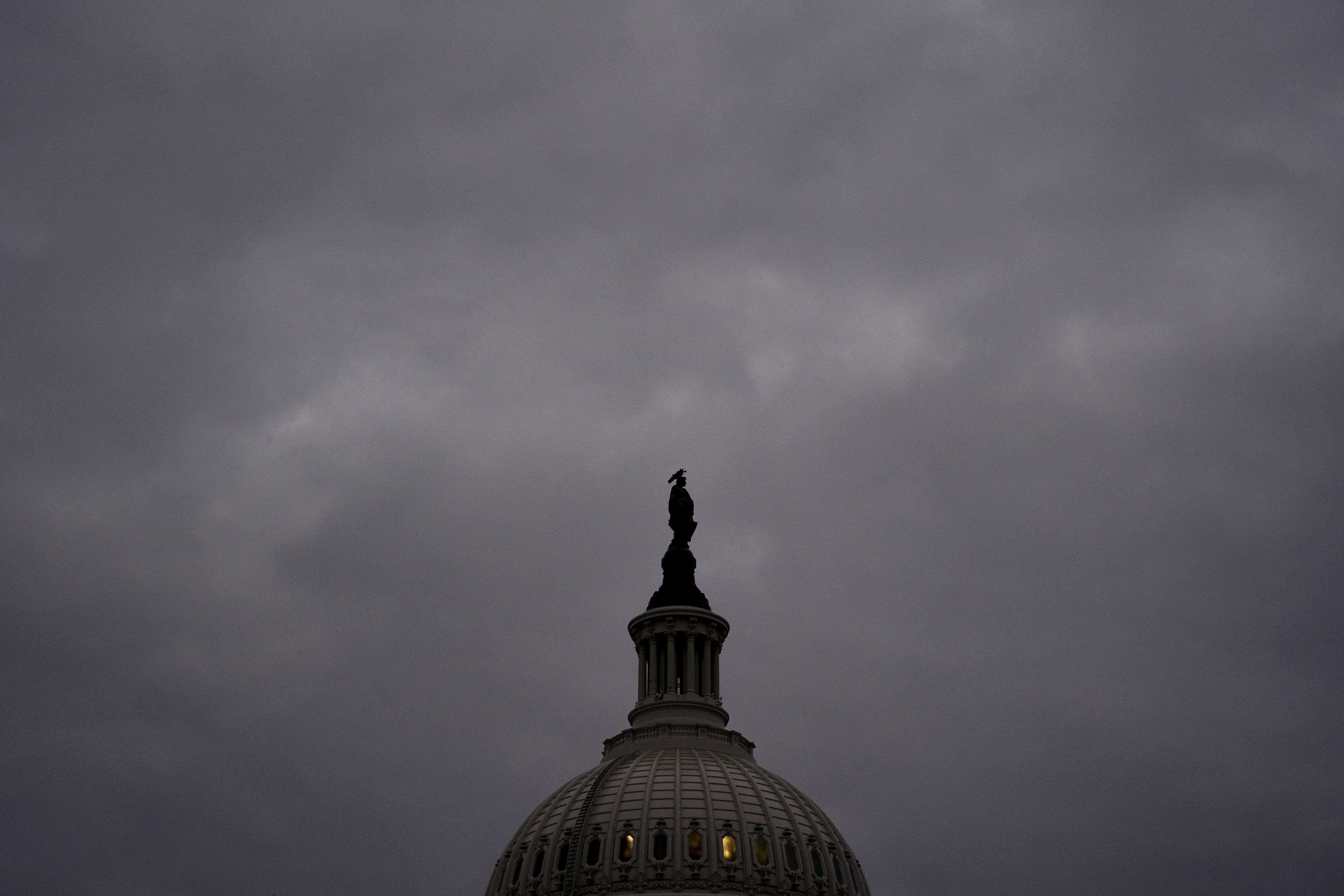 Clouds gather over the US Capitol in Washington on December 10 when the Senate passed legislation creating a fast track to raising the nation’s debt ceiling. The US government’s rising fiscal debt is a factor that could constrain the Fed’s ability to raise interest rates. Photo: Bloomberg