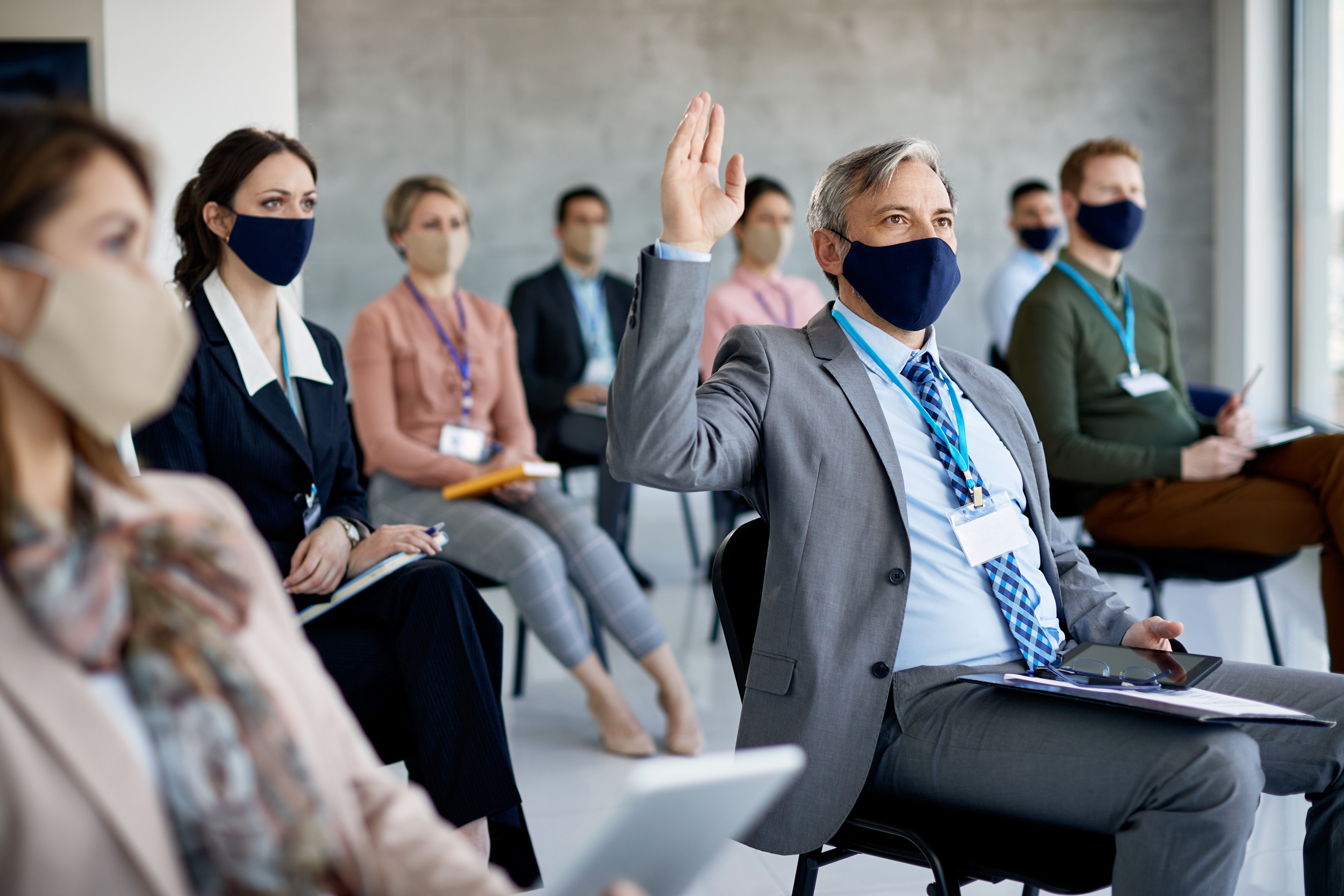A group attend a seminar while following social distancing and mask-wearing protocols, just two of the more obvious ways the world has changed in recent times. Photo: Shutterstock