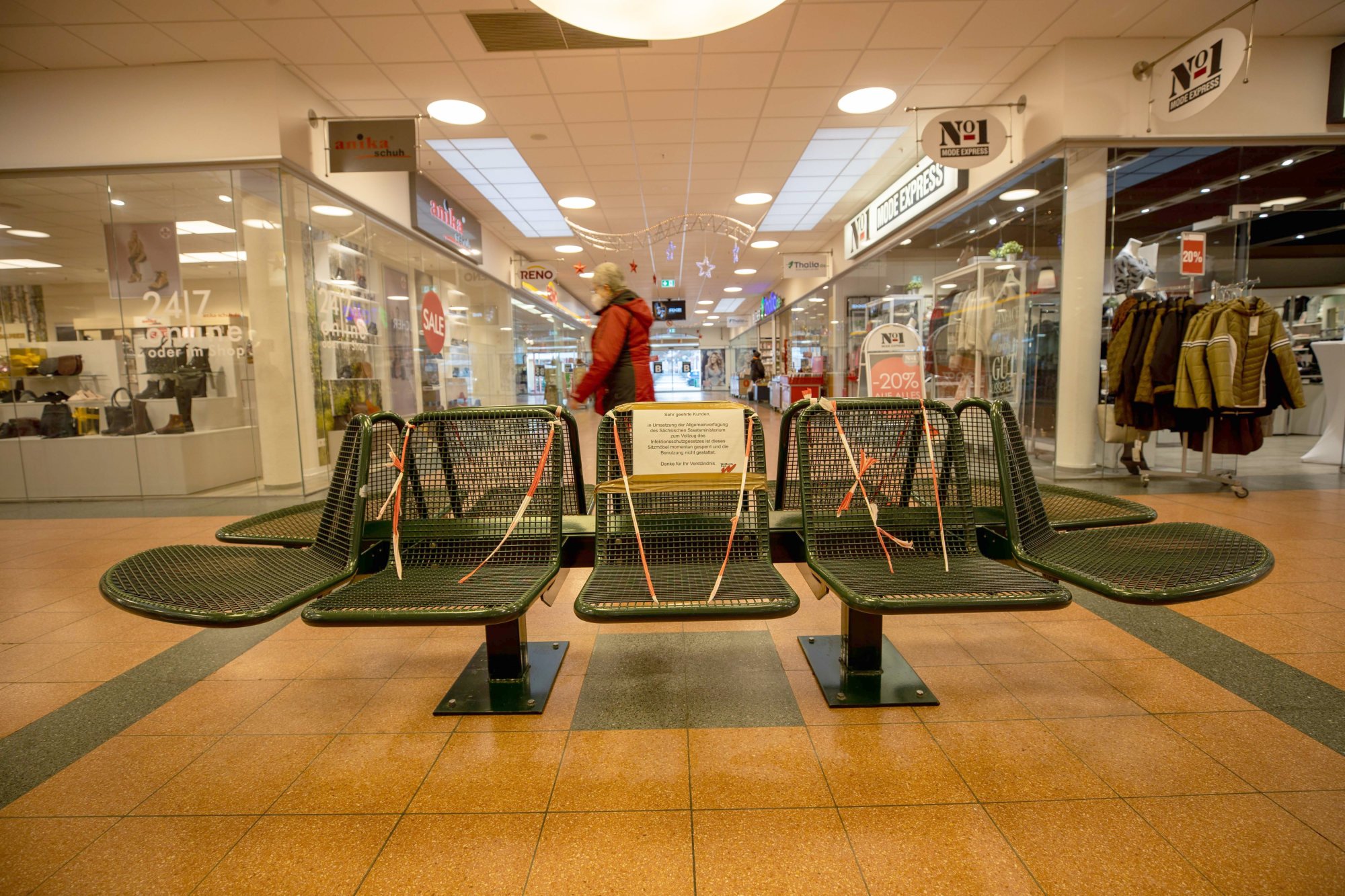 Cordoned-off benches in a shopping centre in Germany after tougher restrictions were imposed. Photo: dpa